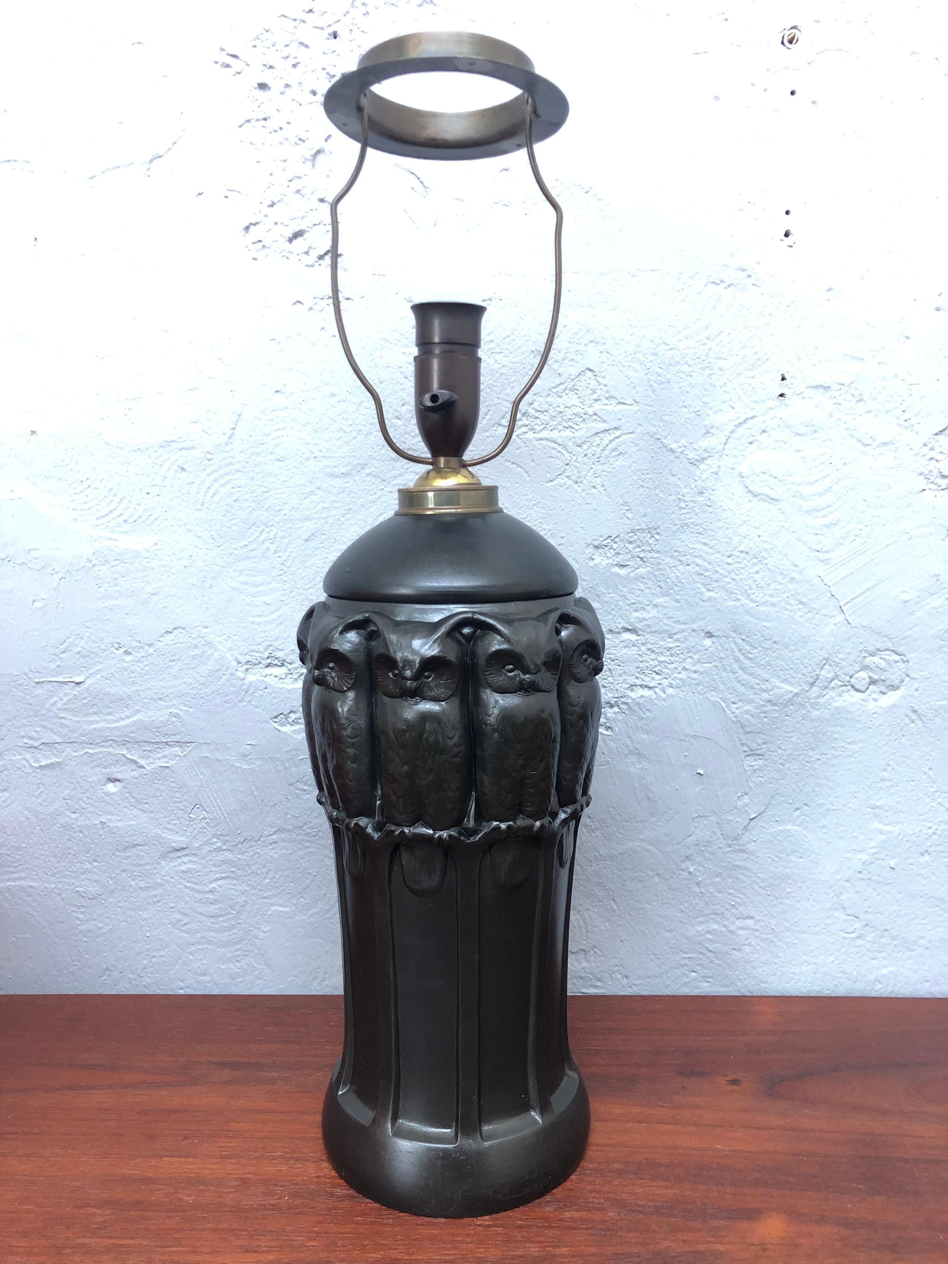 An amazing iconic black pottery table lamp with owls by Lauritz Adolph Hjorth of Bornholm Denmark. 
The lamp has been rewired with a black twisted cloth flex and insulated where it passes through the brass collar. 
Bakelite bulb holder with on/off