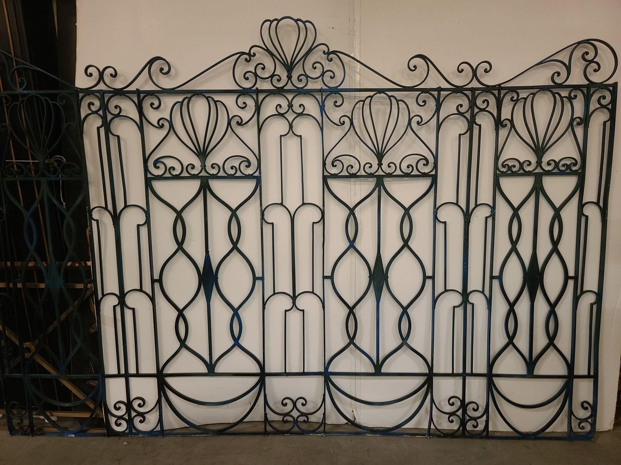 Antique Black Regency Scrolling Wrought Iron Fence Panel featuring scrolling and webbed patterns throughout its design. The gate has a traditional late Victorian Gothic revival design with a modern influence.

Panel: H 74.5