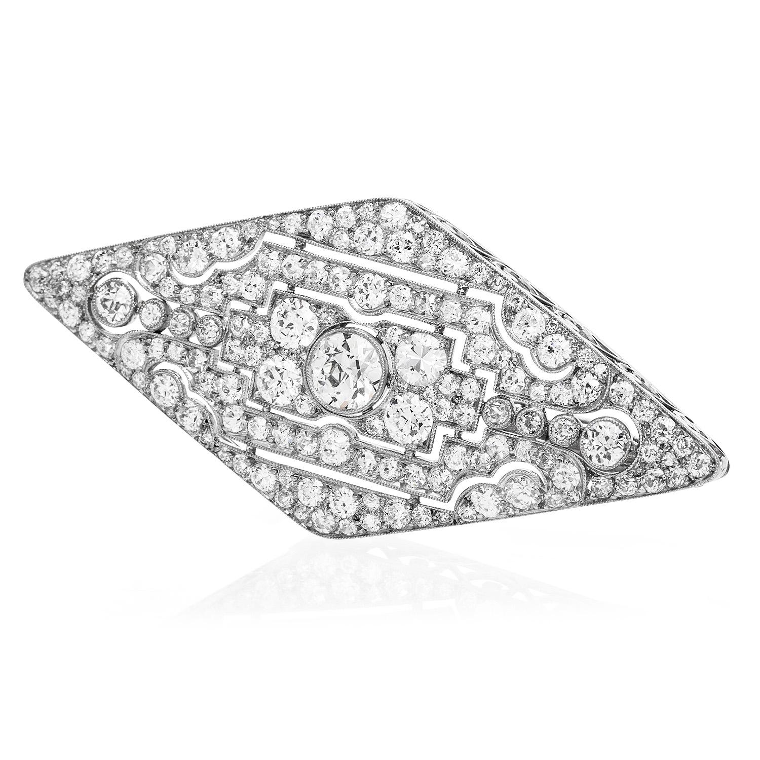 This very fine antique Designer Art deco 1920's diamond Brooch Pin was inspired by a geometric style and crafted in Luxurious Platinum.

Centering an old European-cut round cut diamonds throughout weighing Weighing approx. 1.20 carats, F-G, VS1-VS2