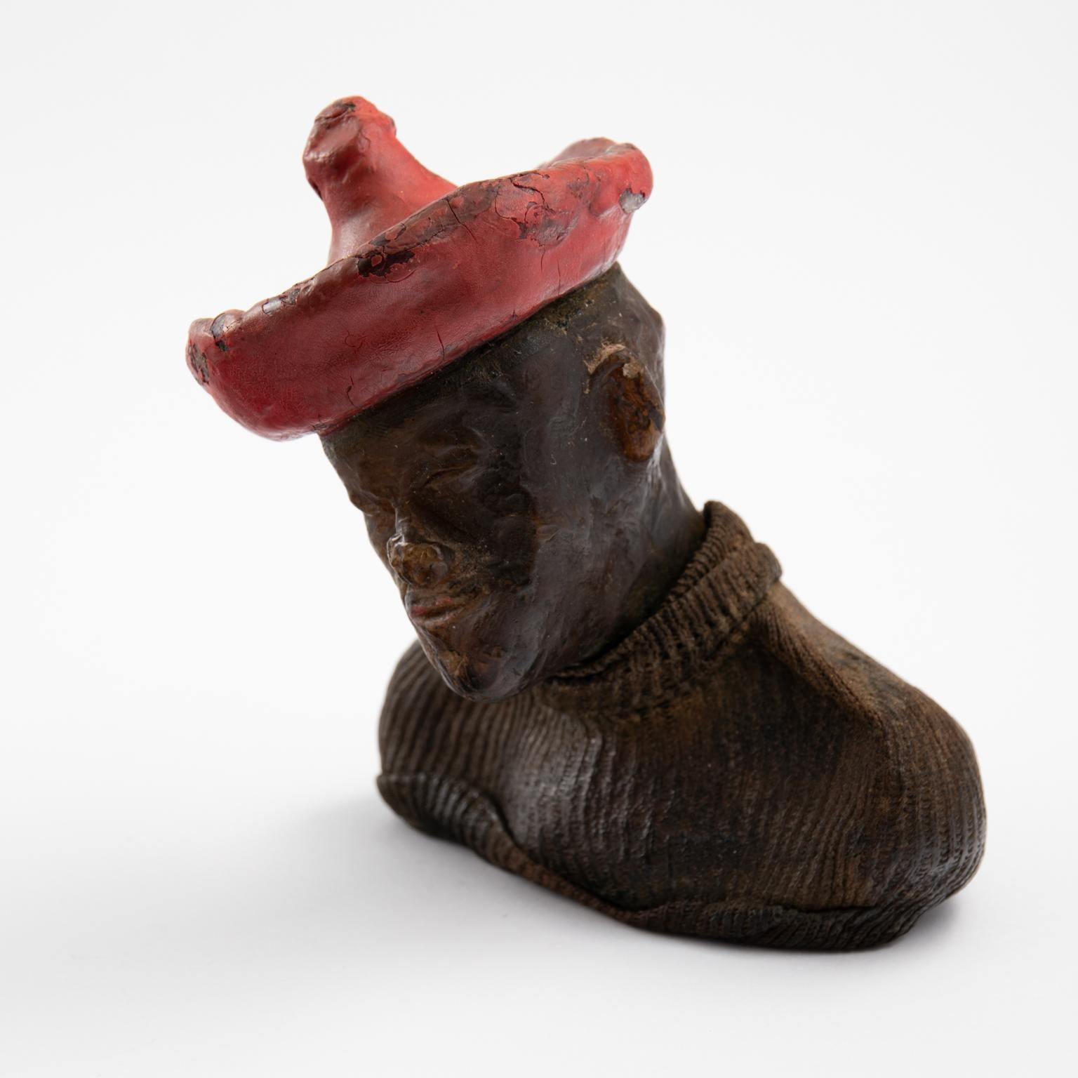 Antique clay figure with fabric hat, circa early 20th century. The head is opposable and can be removed.
 