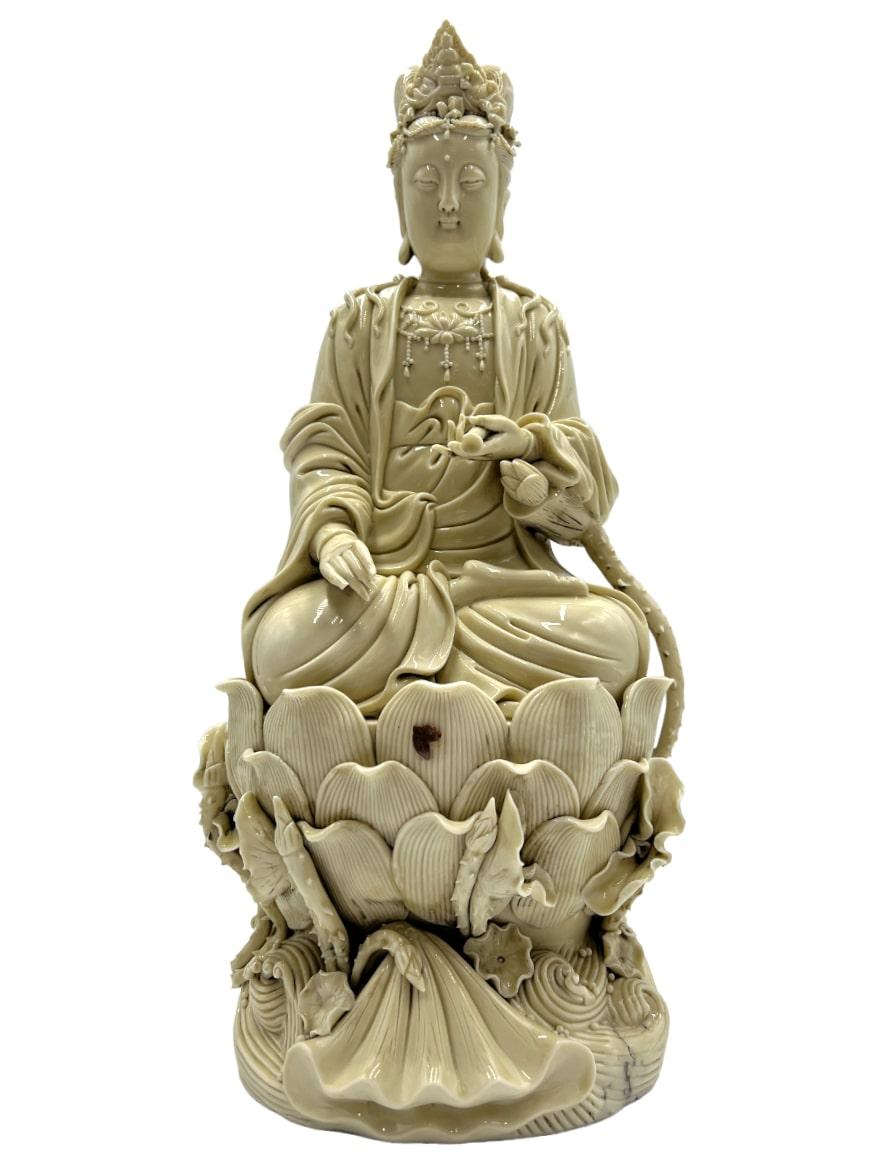 An exquisite Blanc de Chine figurine of Guanyin, a masterpiece of artistry and spirituality. We believe the figurine to be 100+ years old. Crafted with meticulous attention to detail, this porcelain sculpture captures the essence of Guanyin, the