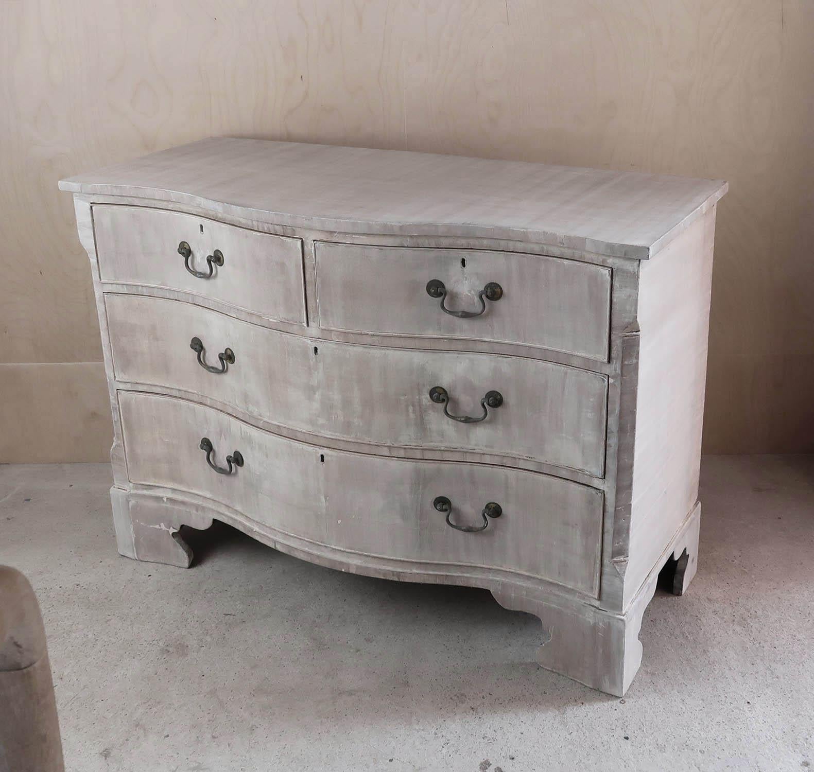Wonderful commode or chest of drawers.

Bleached and lime washed tropical hardwood.

Lovely shaped serpentine front

Veneered drawer fronts. Some historical small patches on the drawer fronts

Original bracket feet

Original blue paper lining to