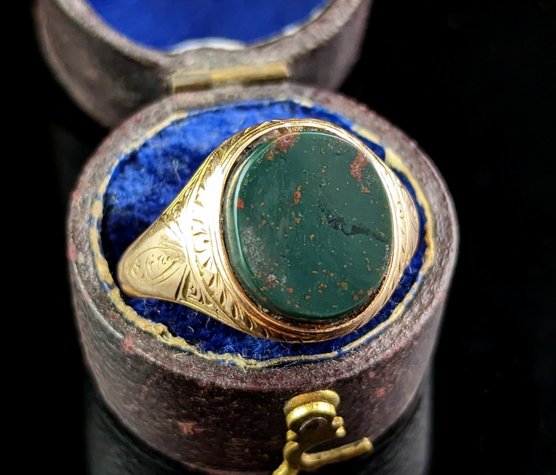 This handsome antique, Victorian era
15kt gold and Bloodstone signet really stands out from the crowd.

It is a delicate yet bold ring, perfect as a pinky ring, the fine engraved shoulders contrasting beautifully with the big bloodstone seal.

The