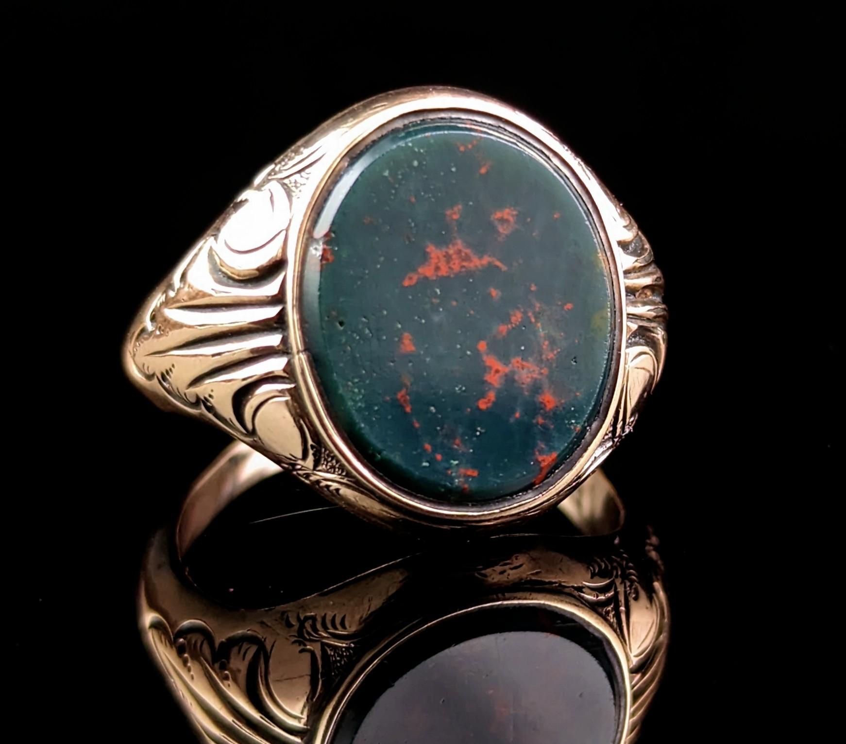 This handsome antique, Edwardian era
9ct gold and Bloodstone signet ring has everything you could wish for in a signet ring!

It is a stylish and bold ring, perfect as a pinky ring, it has an oval face set with a rich dark green Bloodstone, this has