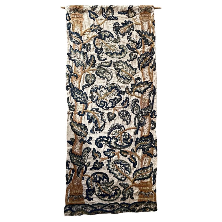 https://a.1stdibscdn.com/antique-blue-and-white-and-gold-floral-crewel-work-wall-hanging-for-sale/f_10842/f_362756021695381613083/f_36275602_1695381613814_bg_processed.jpg?width=768
