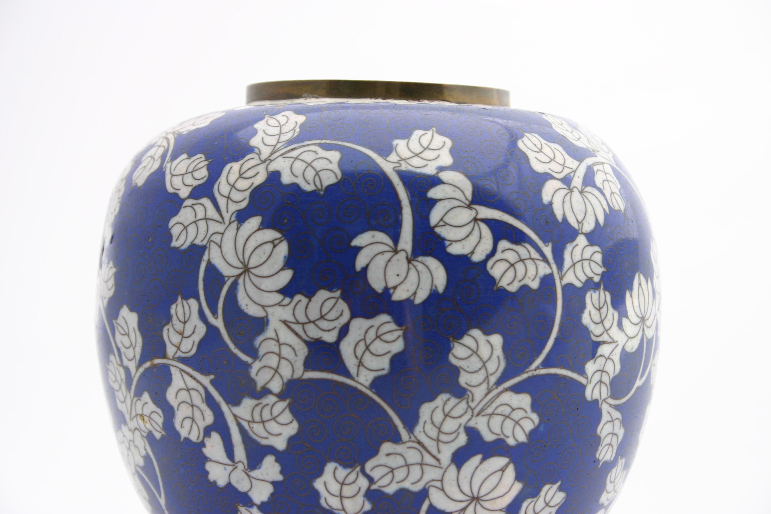 This lovely blue and white antique ginger jar would bring a breath of fresh air to any room. Just add some flowers or feature it's ornate chrysanthemum design on a shelf! Stamped on the bottom 