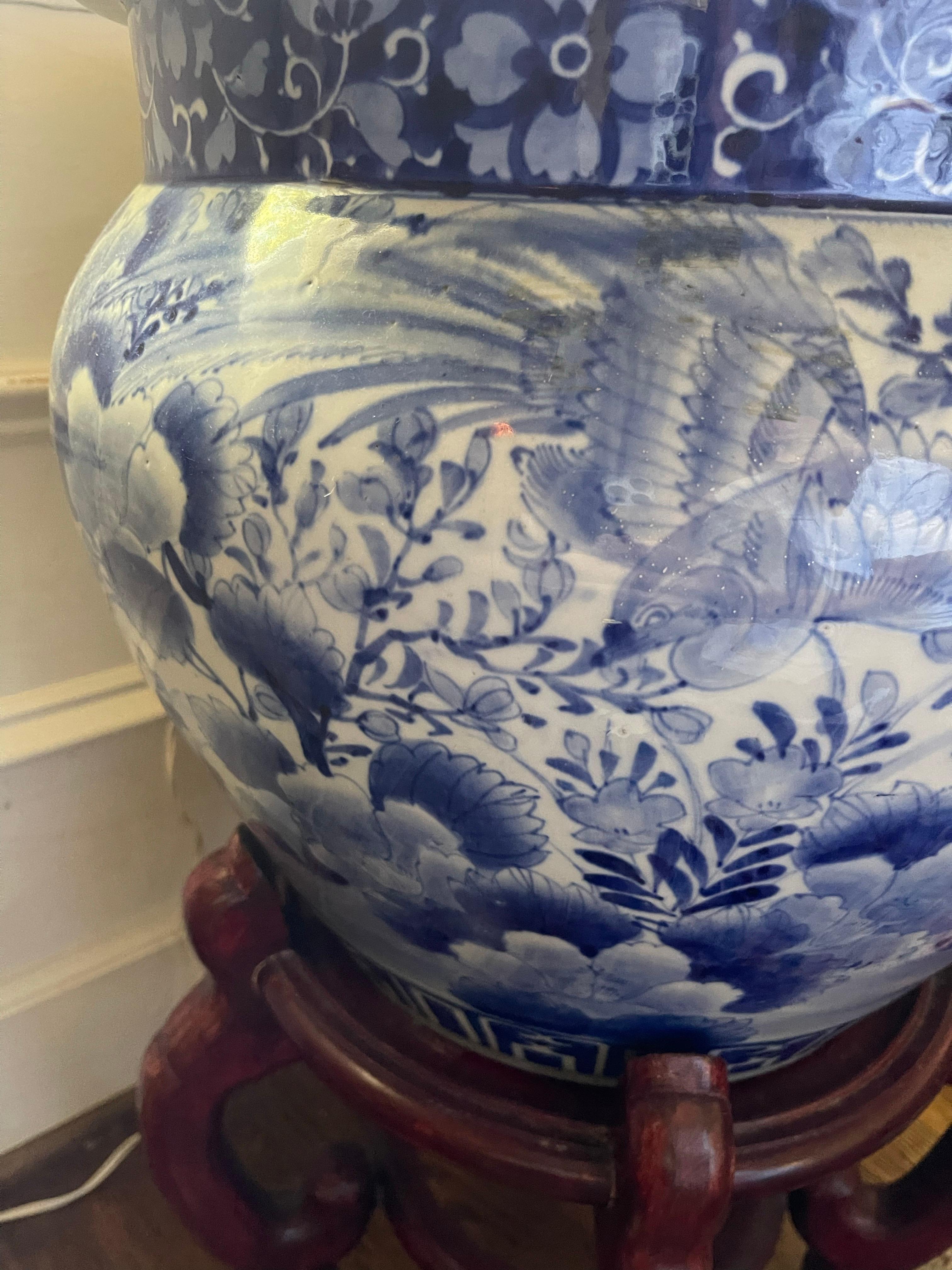 Antique Blue and White Chinese Planter on Wood Stand, 19th Century.  Total height size including planter and stand is 24.25
