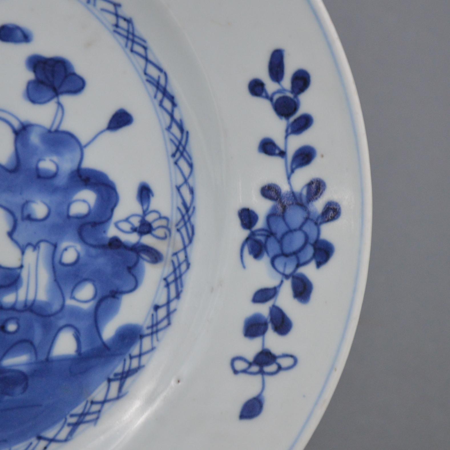 Antique Chinese porcelain plate with underglaze cobalt decoration. Qing period, 18th century.
Very good condition, just some minor firing defects.