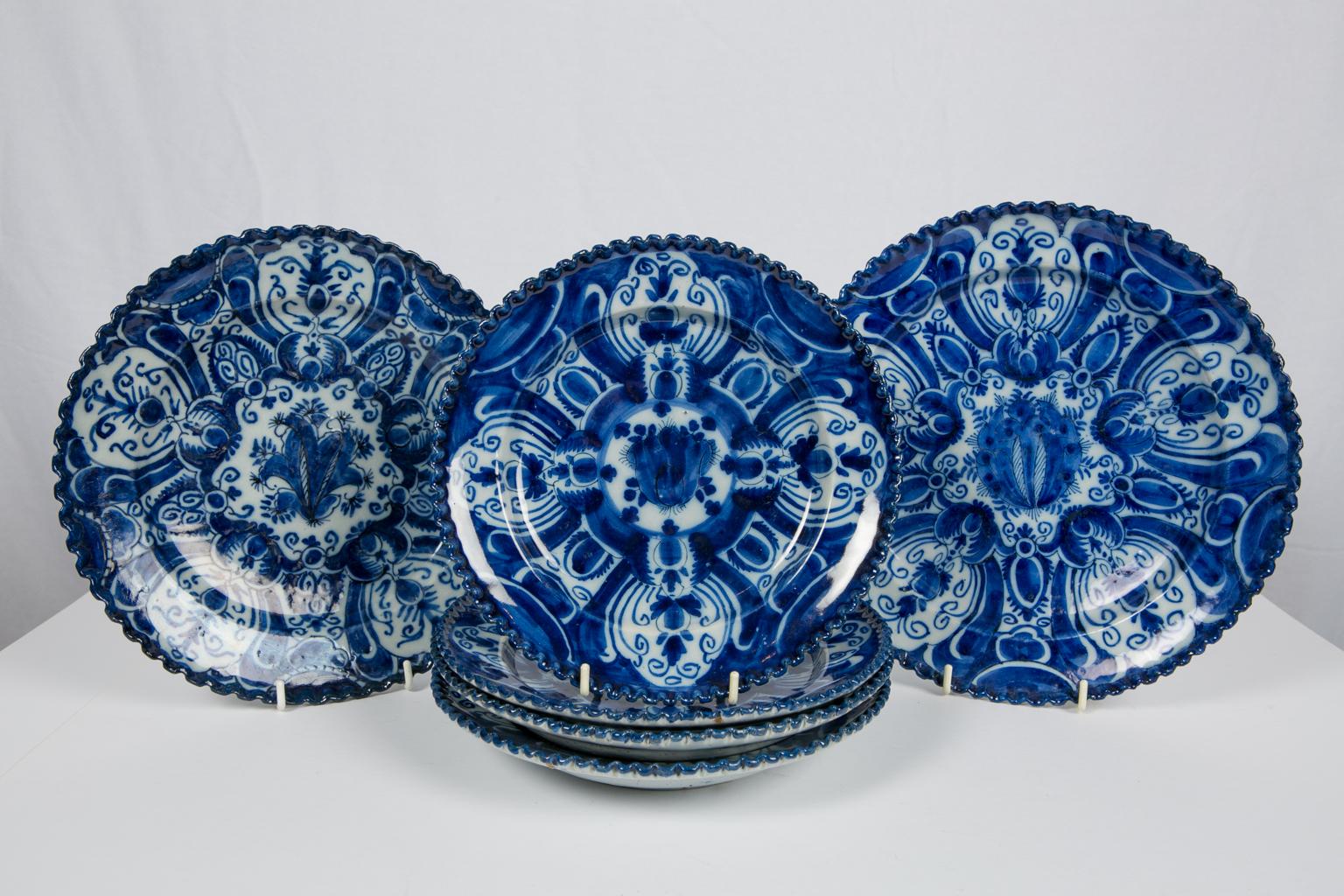 We are pleased to offer these eight antique Blue and White Dutch Delft dishes with a beautiful, intense cobalt blue color.
The pattern is an intricate geometric design of stylized tulips emanating from a central tulip bulb.
The dishes have wonderful