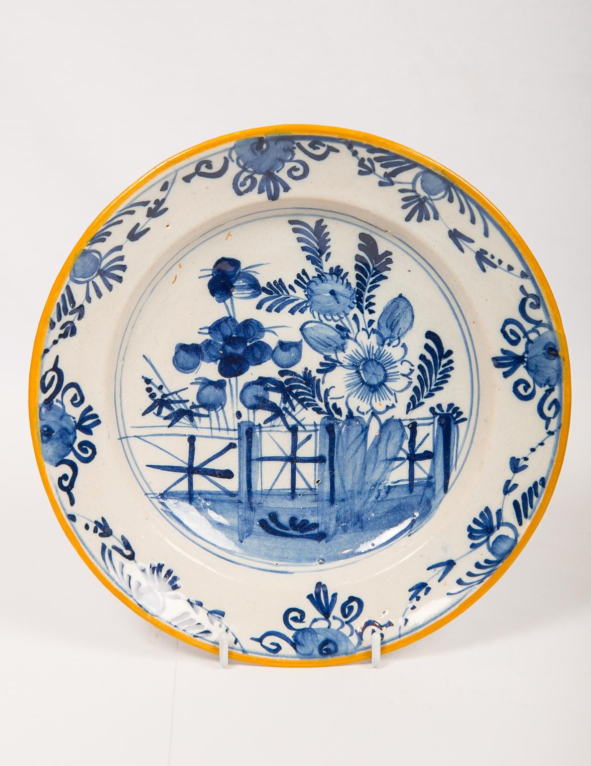 Eleven antique Blue and White Dutch Delft dishes hand-painted showing a variety of traditional scenes including a deer in the forest, floral bouquets, and gardens overflowing with peonies (see images).
The decoration on each dish in the group is