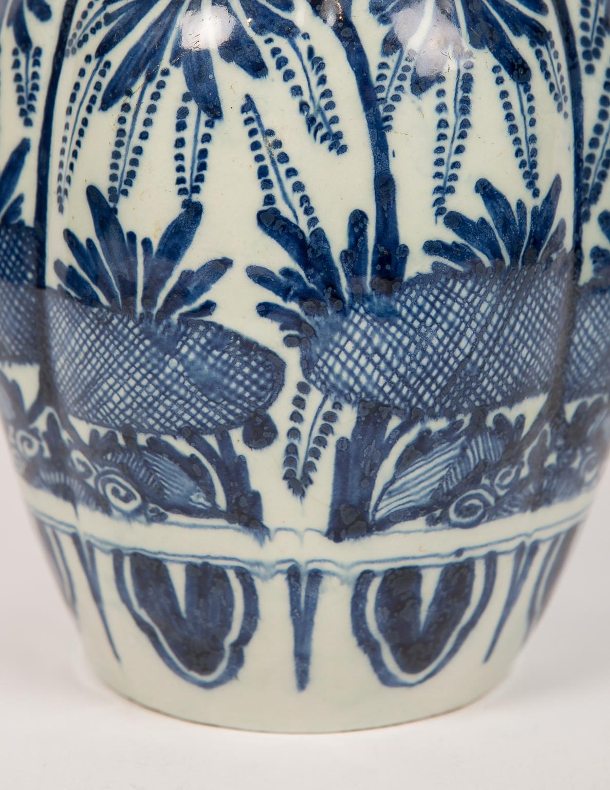 An antique blue and white Dutch Delft ginger jar made in the 18th century, circa 1780. The jar features floral design in deep cobalt blue and a beautiful glaze. The cover with a similar design has attractive lobed edges (see image #4), and a