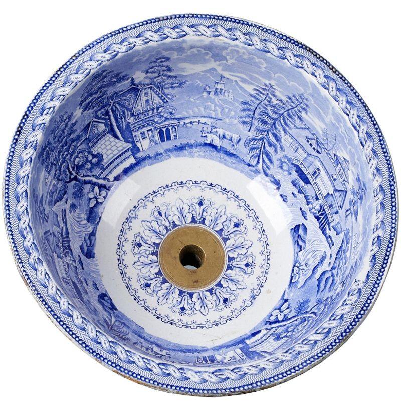 Antique blue and white transfer printed porcelain sink. A circular blue and white transfer decorated wash basin in a classical Victorian design.
