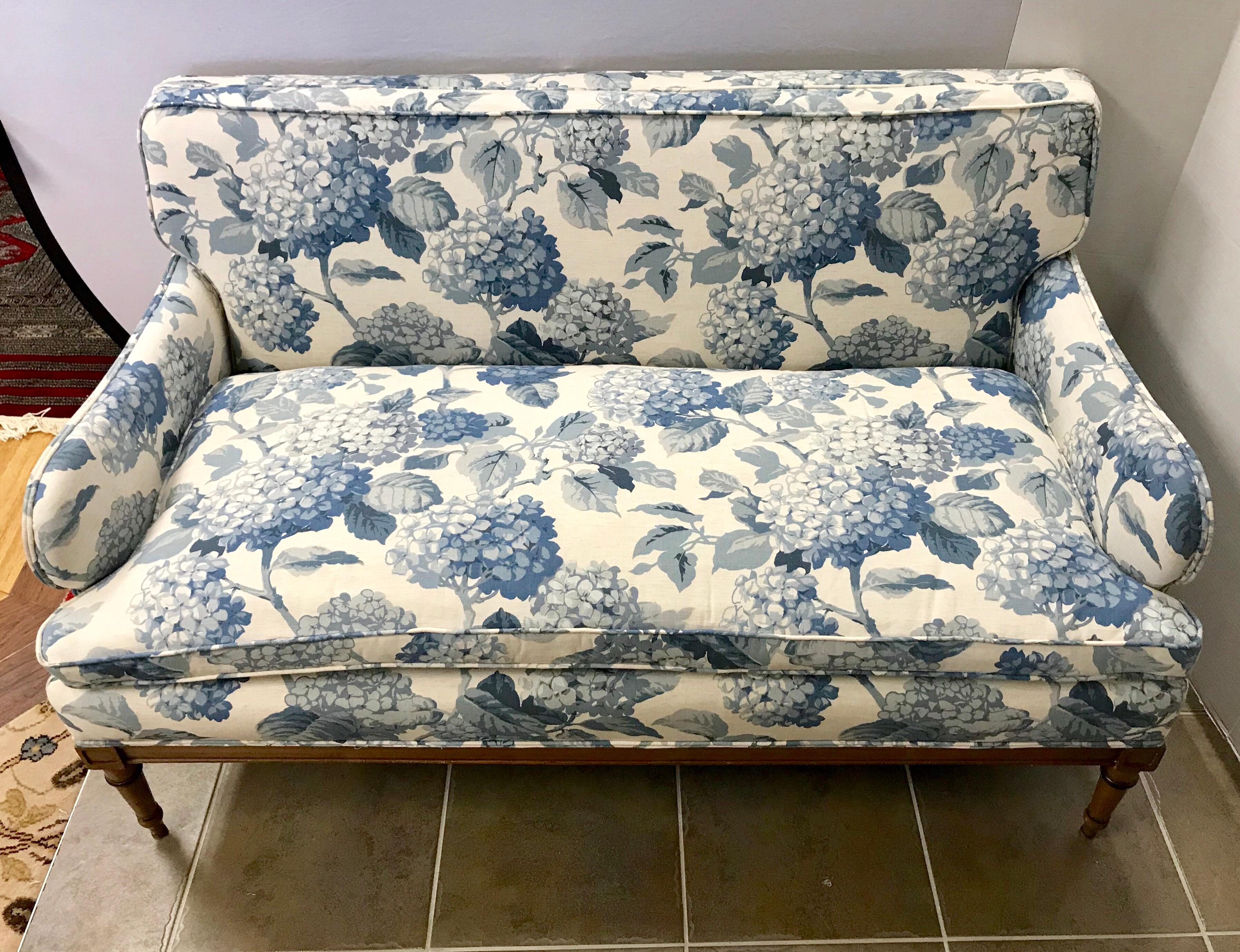 Pretty loveseat settee with new blue and white cotton upholstery with a large hydrangea print. Loose down filled seat cushion.
 