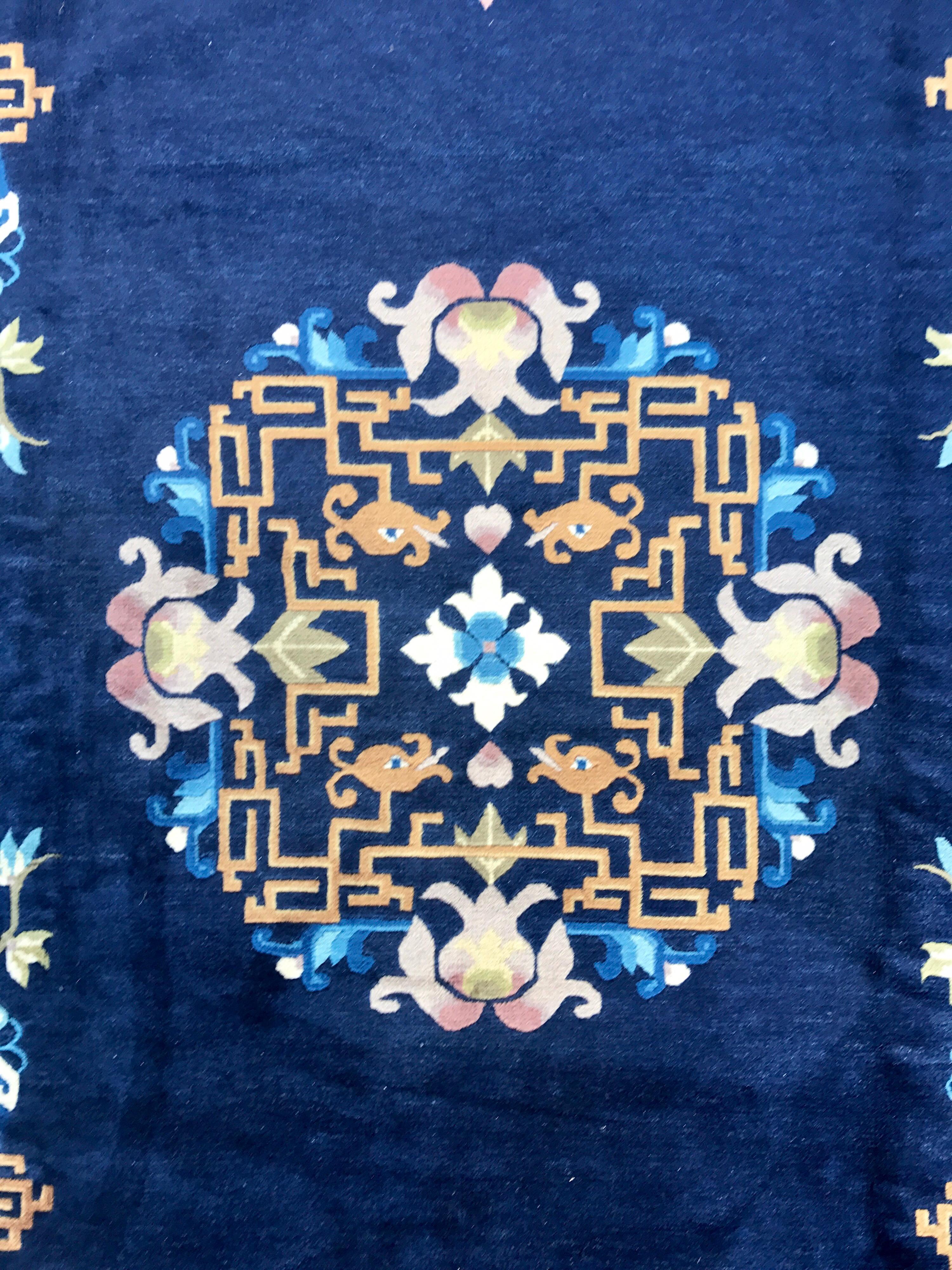 Beautiful antique blue Chinese rug, circa 1920s. The colors are still vivid and magnificent. There is some wear on fringe but otherwise rug is in fabulous condition. Dimensions are nine feet seven inches by six feet seven inches.