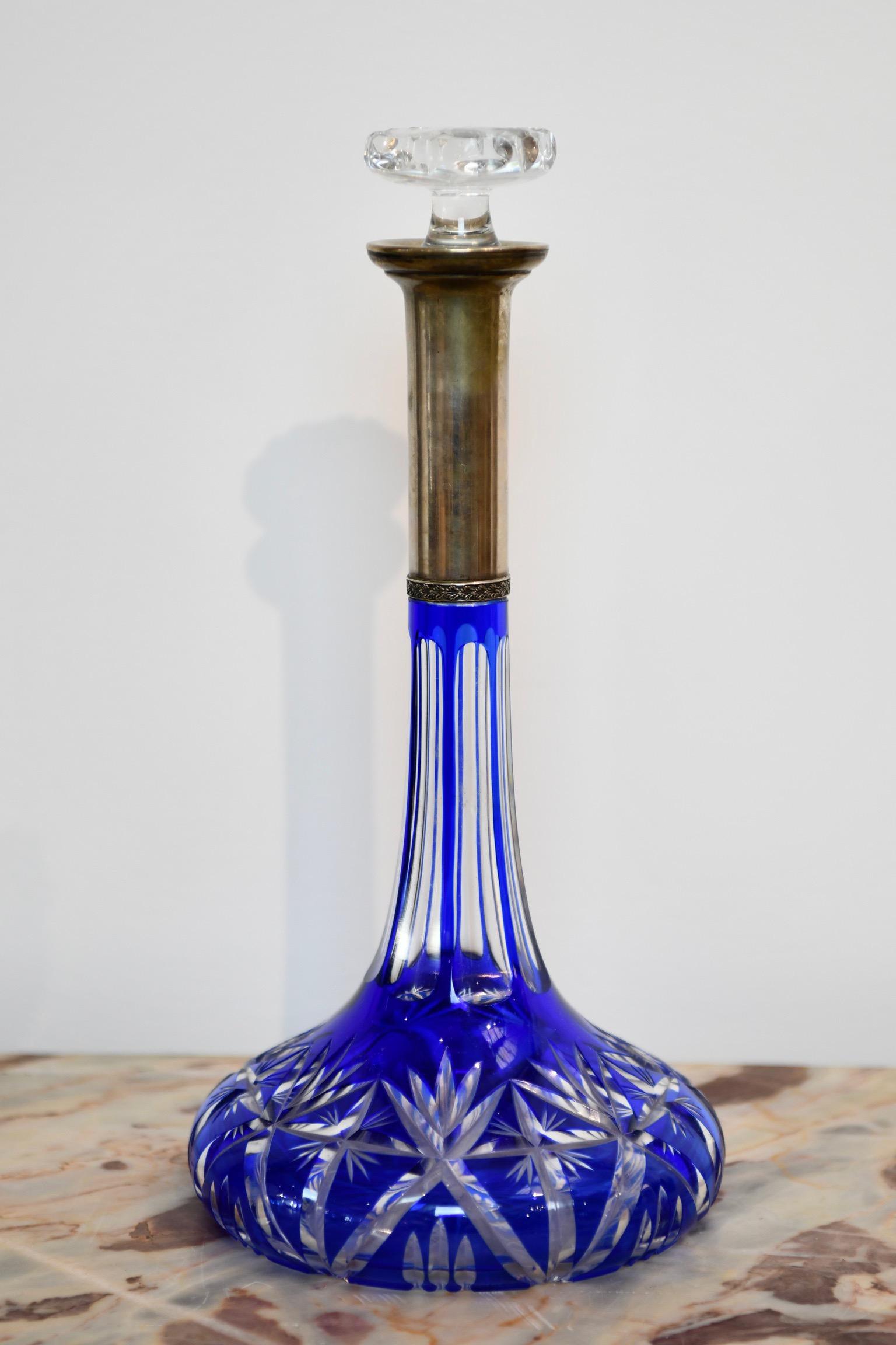Antique blue cut to clear decanter with 800 silver neck. Apparently unmarked and in good antique condition. Similar second decanter with blue stopper also available, sold separately. Dimensions: 14.75