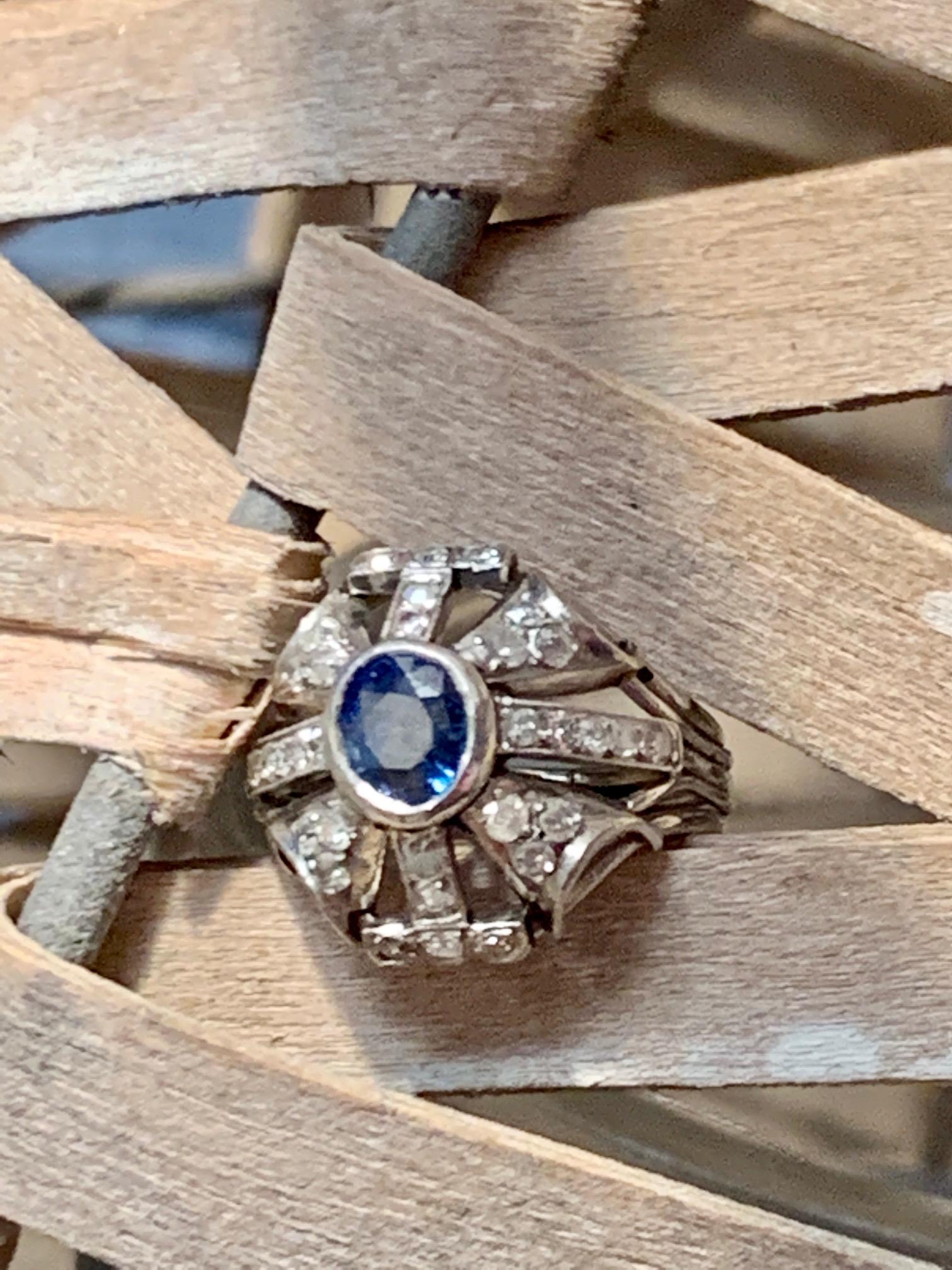 This gorgeous ring features a 6 x 5.5mm blue faceted Sapphire and 34-1.5mm side Diamonds totaling approximately .50ctw.  
Average grade: I(2)-H
Weight: 6.9 grams
Size: 3 3/4 - This ring can be resized, but G. Lindberg Jewels does not provide sizing