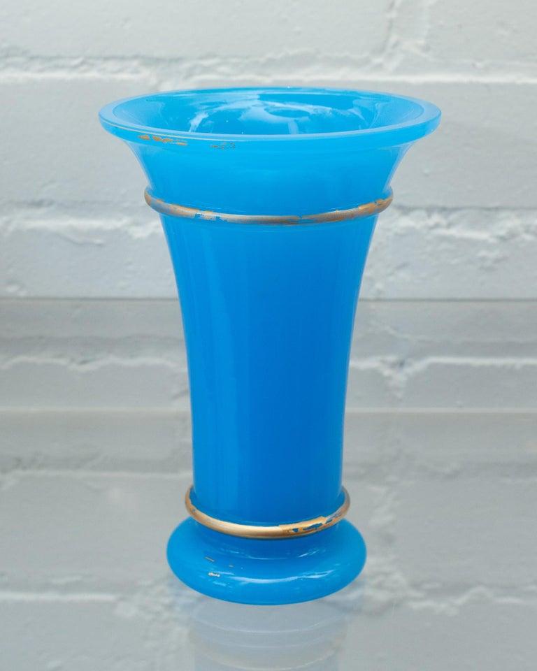 A beautiful blue opaline vase with gilded detail. Opaline glass was made in France between the years of 1810-1890. This fine example of the material is extremely sturdy and well made, some wear to gilding.