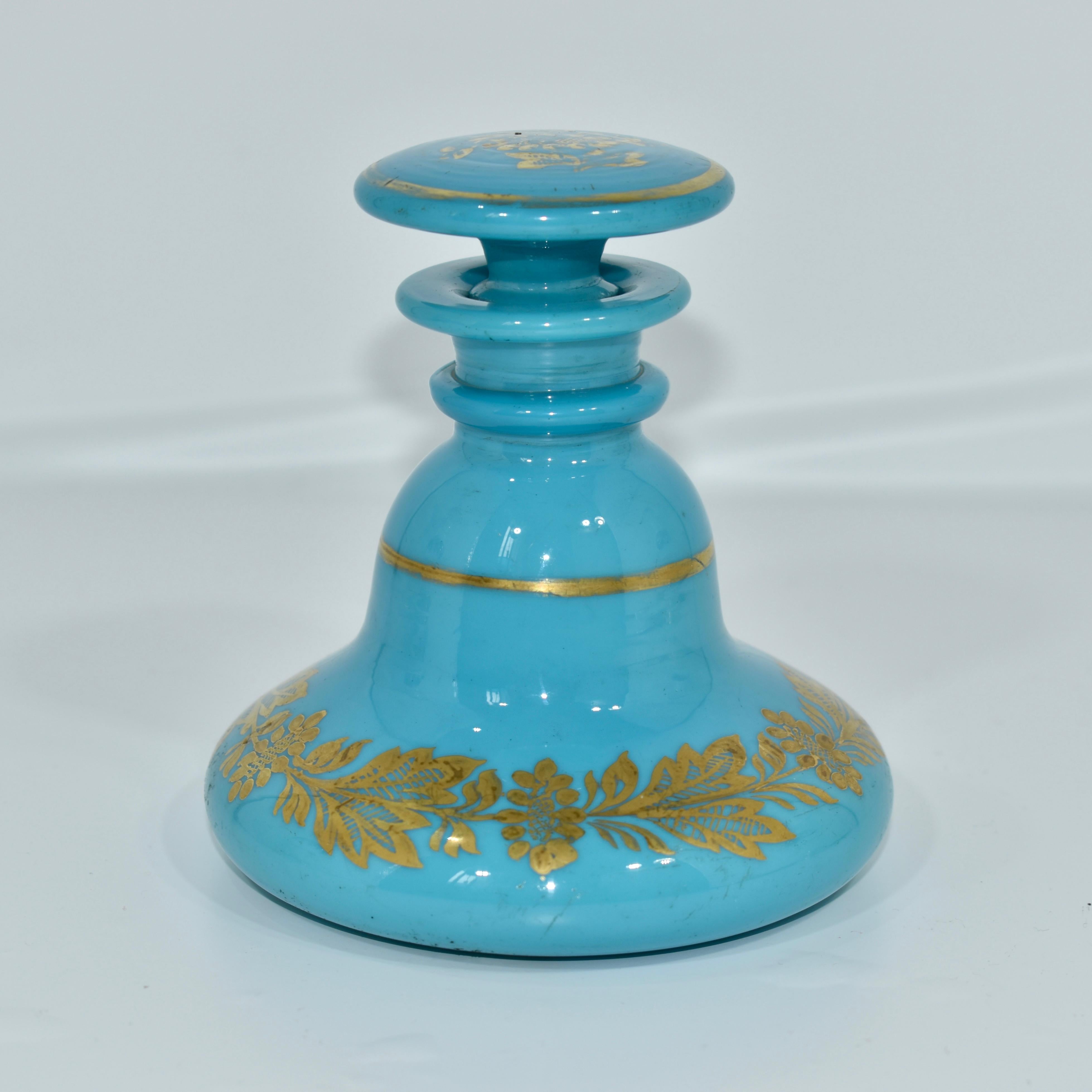 High quality perfume bottle and stopper in blue opaline glass with gold enamel decoration

beautifully shaped circular body features gilding highlights and a continuous line hand-painted gold decoration

France, Charles X

Height 25 cm