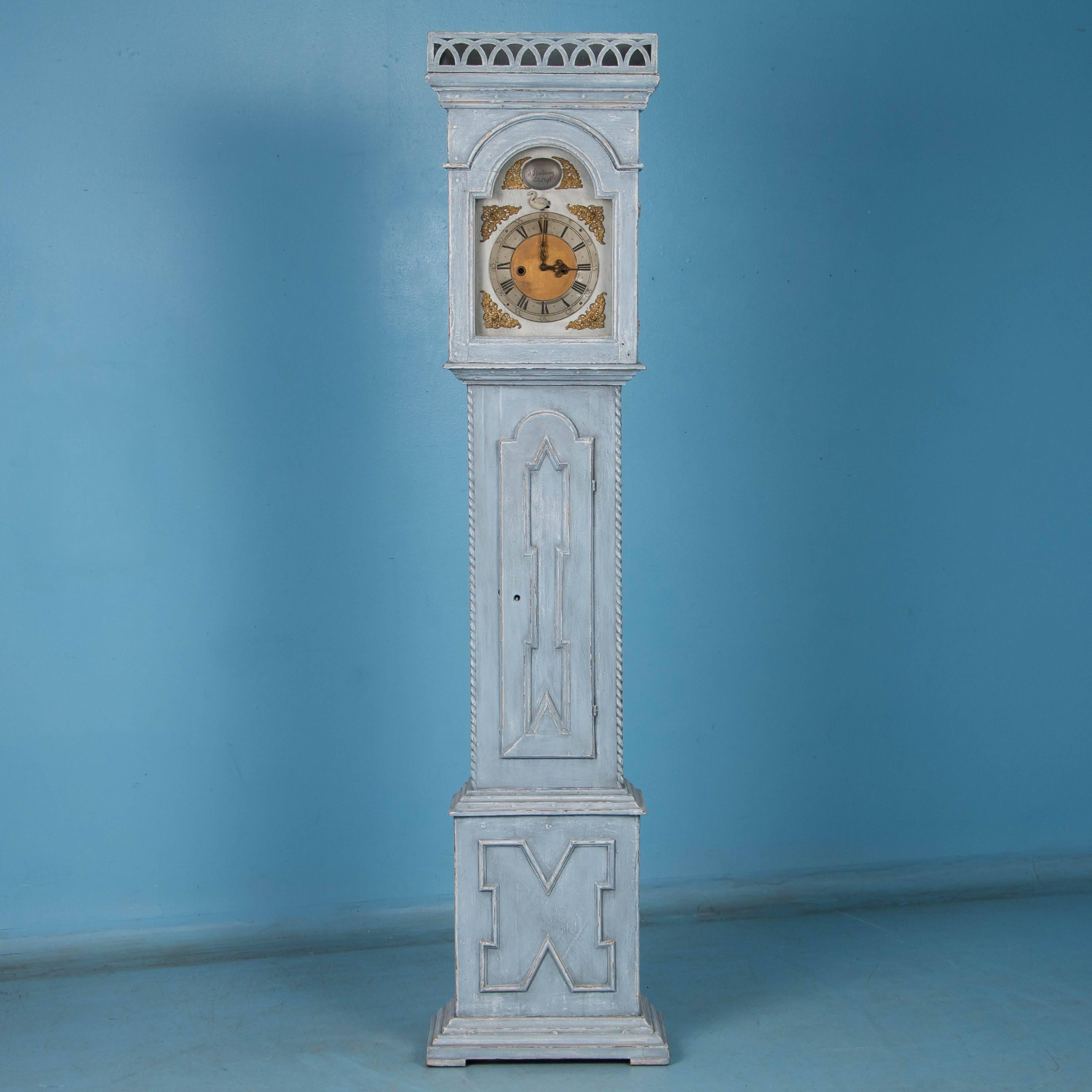 The wonderful proportions, color and carved molding of this striking antique grandfather clock are revealed in the Danish craftsmanship. Please examine the close up photos to appreciate the distressed light blue painted finish which compliments the