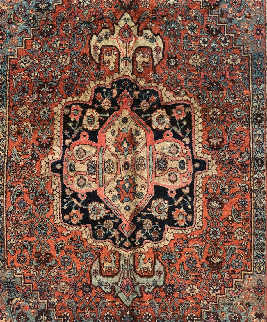 This is a lovely antique blue and rose Persian Bijar rug hand knotted in Iran in the 1900s-1910s and measures: 7.4 x 10.6 ft.

Bijar rugs are mainly woven in the town of Bijar and its surrounding villages. Bijar is located in the province of