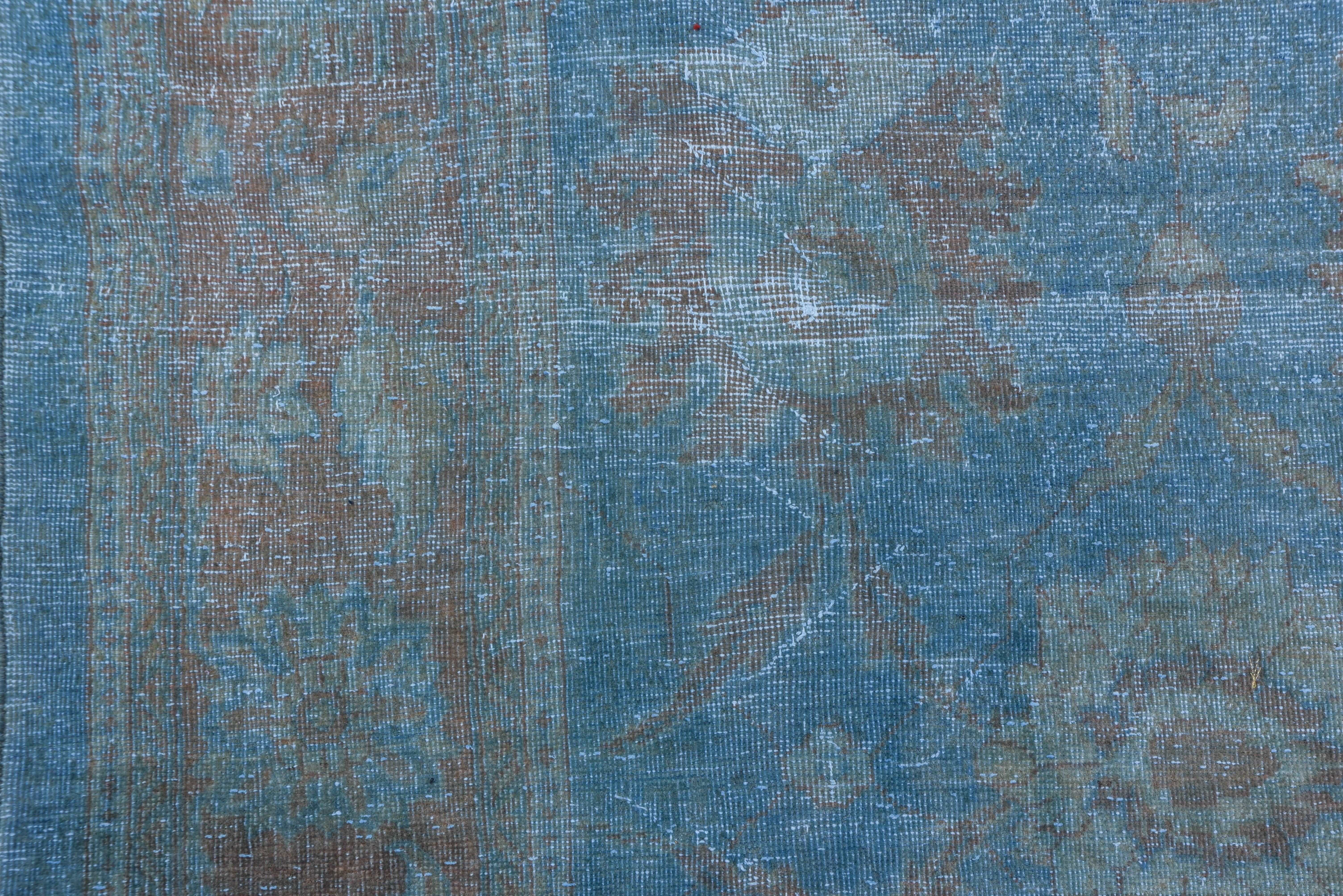 The lucid light blue field displays a symmetric large palmette pattern within a rust palmette border. This west Persian village carpet lightly distressed and decorative.