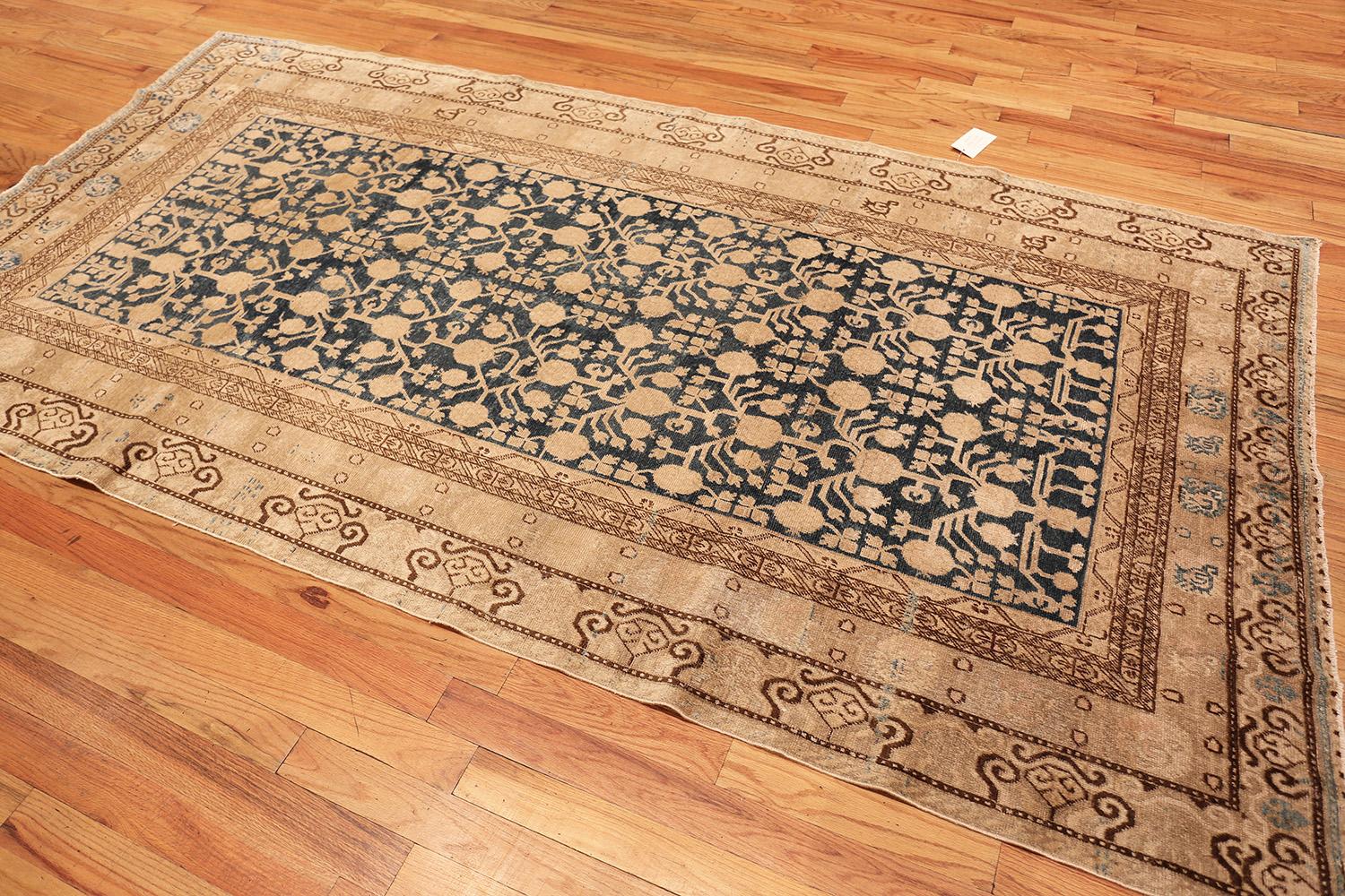 Wool Antique Blue Pomegranate Khotan Rug. Size: 5 ft 7 in x 10 ft 6 in