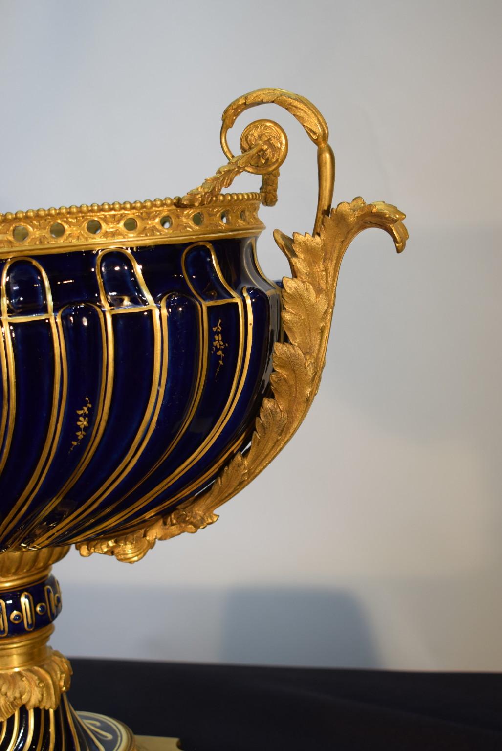 Louis XV style gilt bronze mounted blue and gilt porcelain centerpiece bowl.