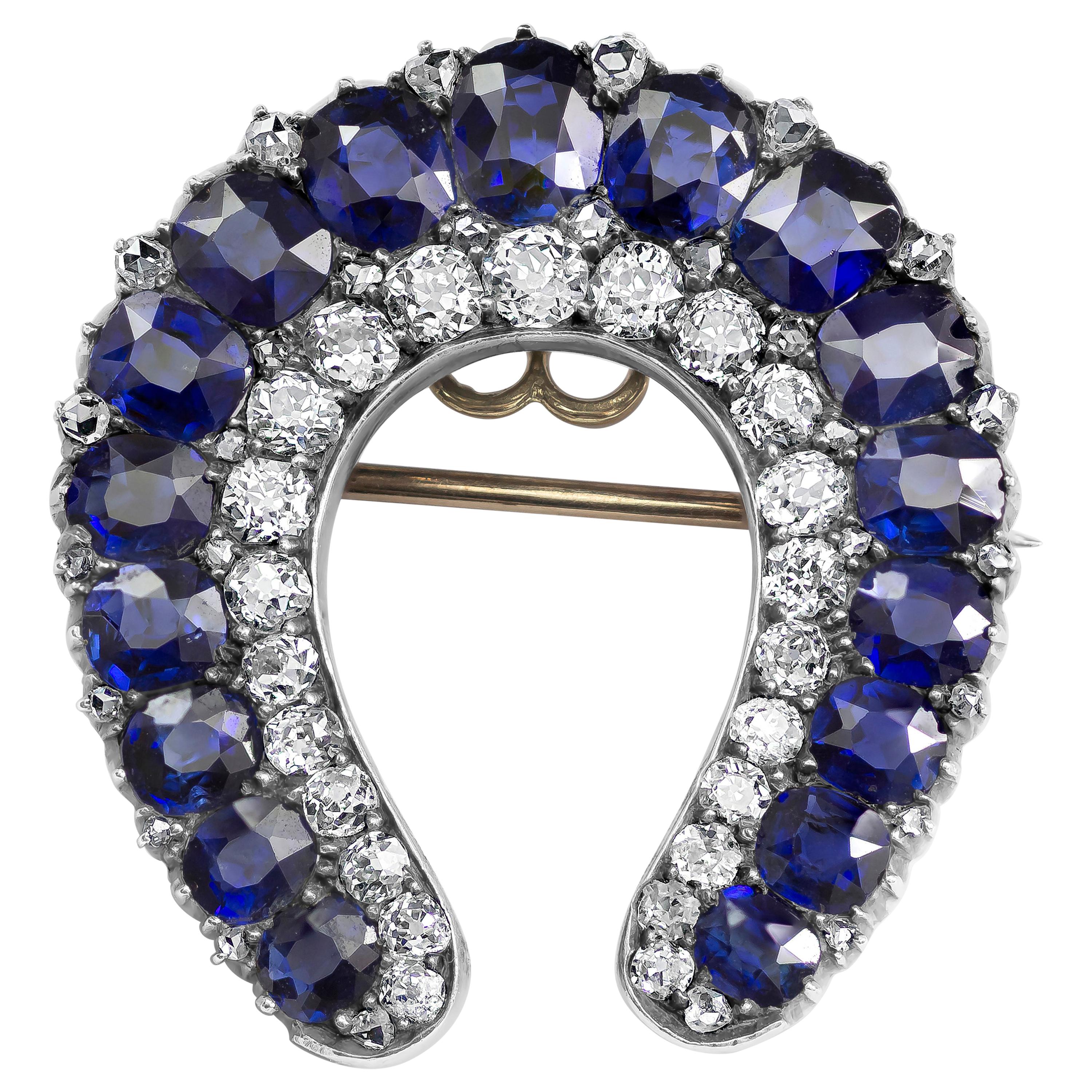 Antique No-Heat Blue Sapphire and Diamond Horseshoe Brooch For Sale
