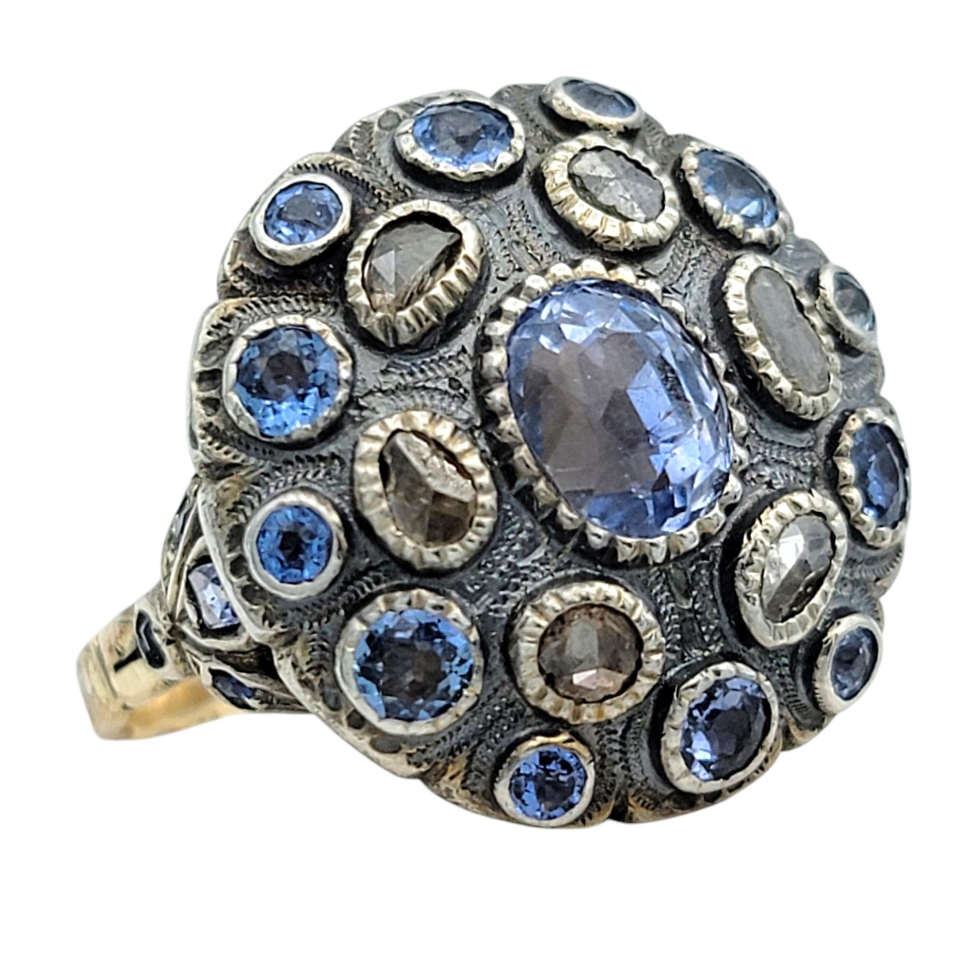 Ring Size: 7.25

Step into timeless intrigue with this exquisite antique sapphire and diamond poison ring, a true testament to craftsmanship and mystery. At its heart lies a bold dome-shaped design, intricately adorned with vibrant blue sapphires in