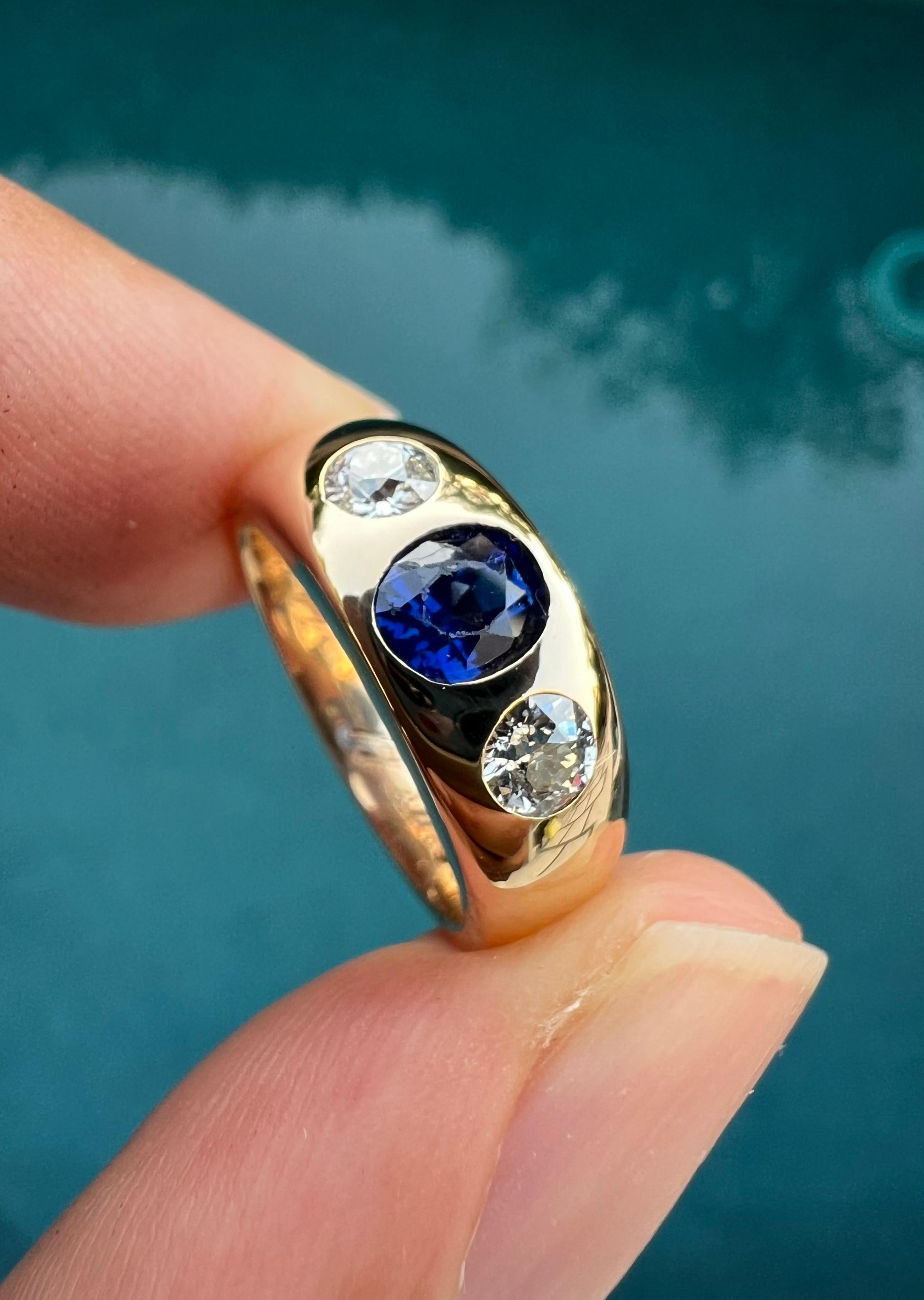 Hello!

I have a diamond/gemstone gypsy ring available from the Austrian-Hungarian empire. The center stone is an 0.70ct natural blue sapphire and is flanked by two very high quality, VS clarity/G-H color old European cut diamonds. 

The gold is a