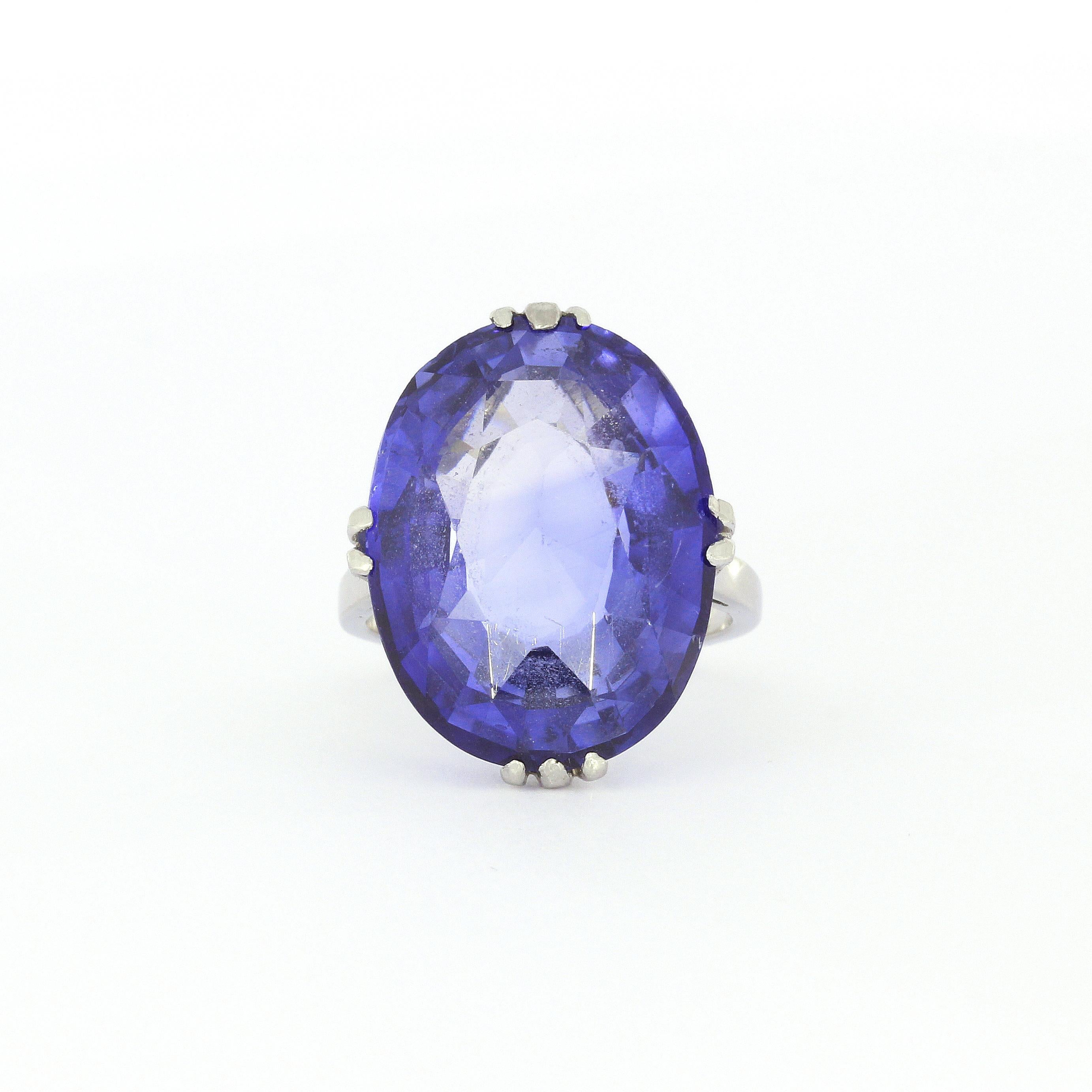 Authentic Antique Blue Synthetic Sapphire in a typical Ceylon color from around 1900-1930.
These synthetic sapphires were commonly used in high grade jewelry from the early 1900s and later. 

Weight of synthetic sapphire: 10 Carat plus 

L: 22mm
W: