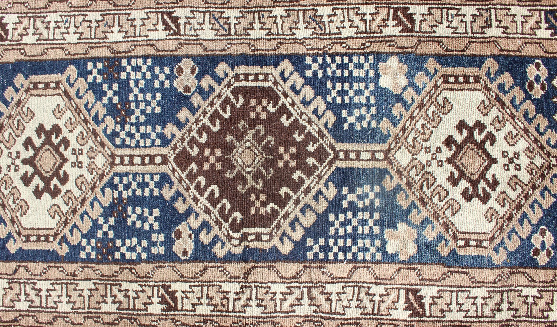 Early 20th Century Antique Blue Tribal Karajeh Runner With Navy Blue, Brown and Earth Tones For Sale