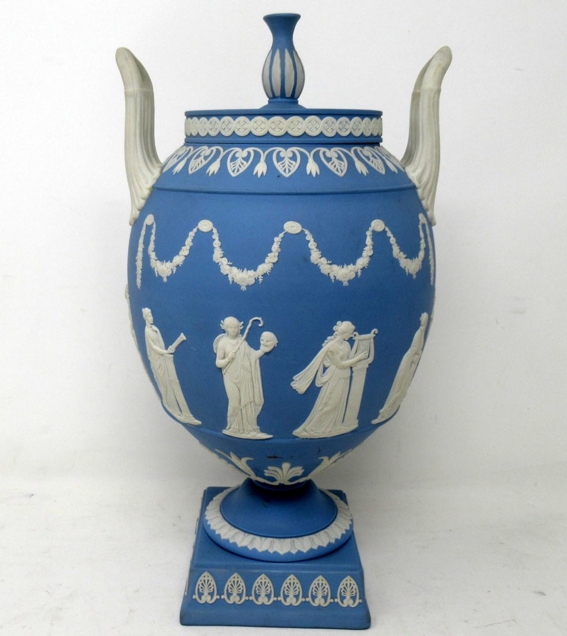 An Exquisite and quite rare English Staffordshire Wedgwood Jasperware blue ground Vase of Amphora outline and generous proportions, after an earlier model by John Flaxman Junior. Circa mid Twentieth Century. 

The arch ovoid body sprigged in white
