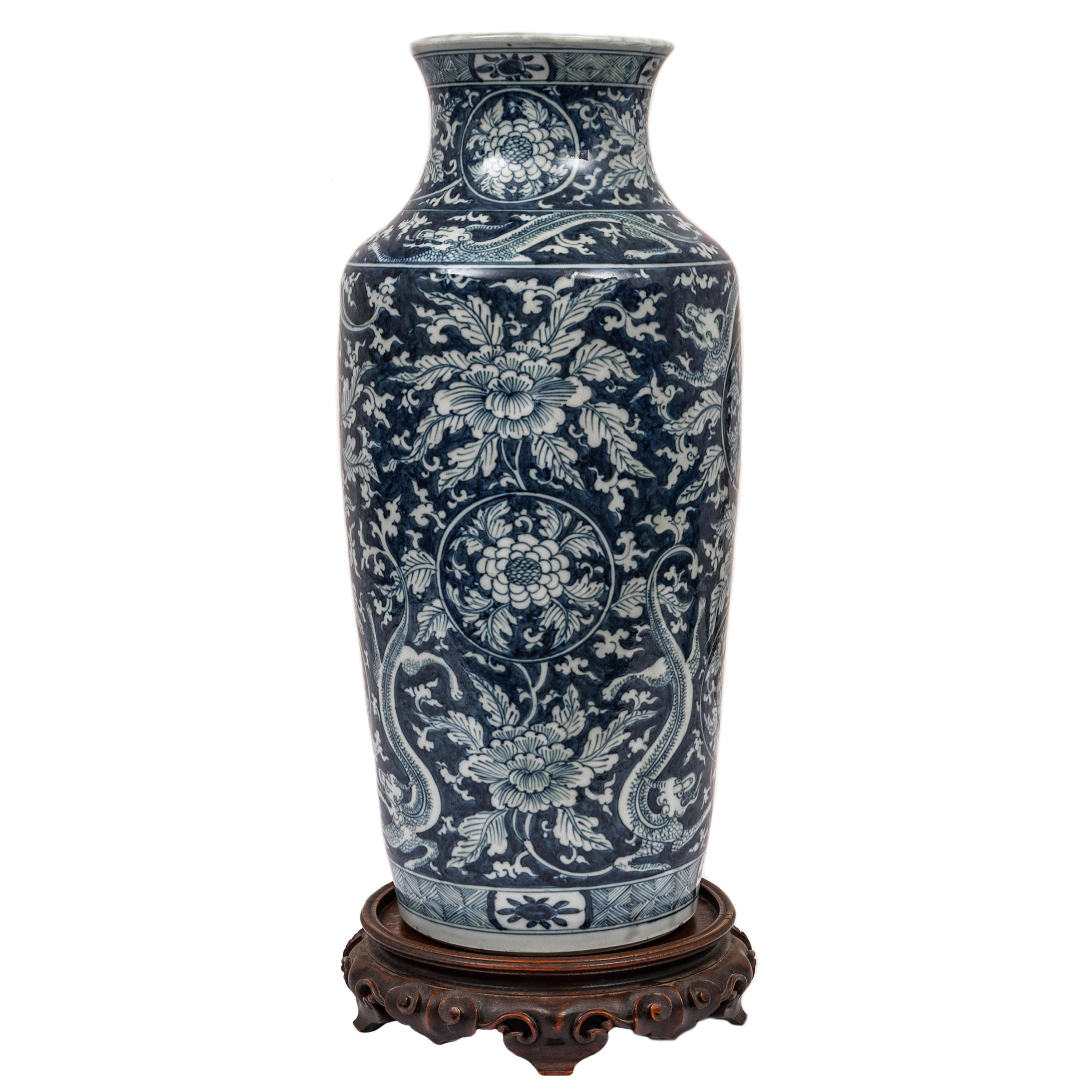 A large and rare antique Chinese Qing Dynasty Blue & White Porcelain Rouleau dragon vase, Kangxi period (1662-1722), the vase dating to the late 1600s.
The vase of slightly tapered cylindrical form, with a broad neck and flared mouth, painted in