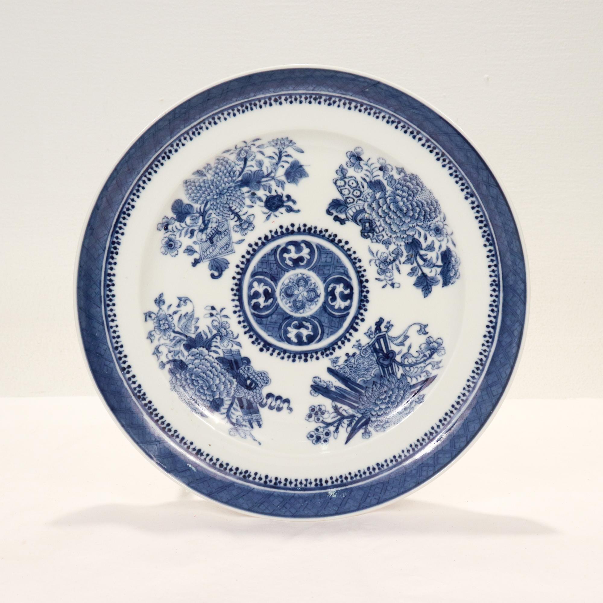 A fine antique Chinese Export porcelain plate in the Fitzhugh pattern.

Decorated in underglaze blue with floral devices to the face, and a border to the rim with a repeating diamond fretwork pattern.

Simply a great Chinese Export