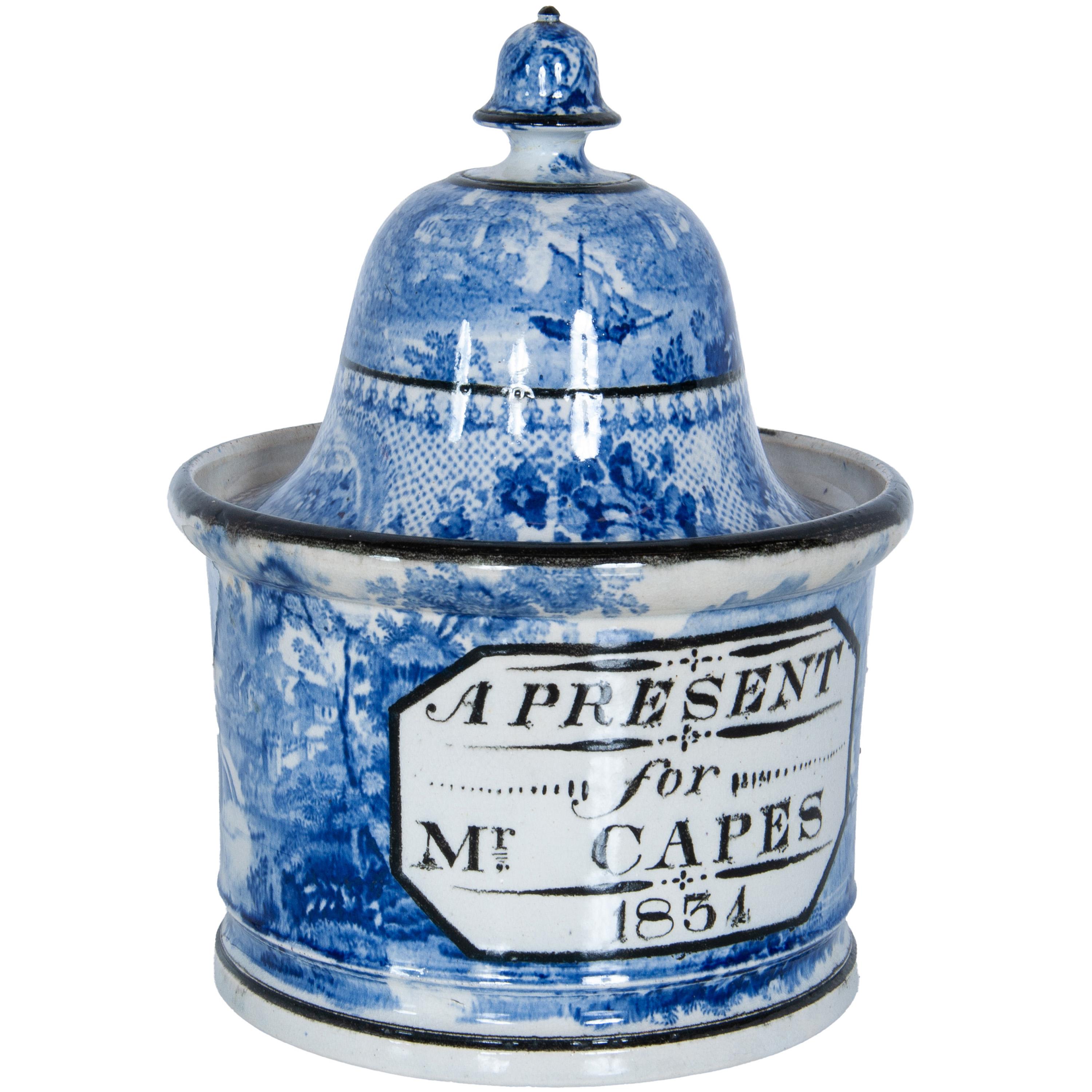 A very rare dated & inscribed William IV period Pearlware blue & white pottery humidor/ tobacco jar & cover, 1834.
The jar with a pronounced dome or bell shaped cover mounted with an acorn shaped finial, both the cover & base are finely decorated