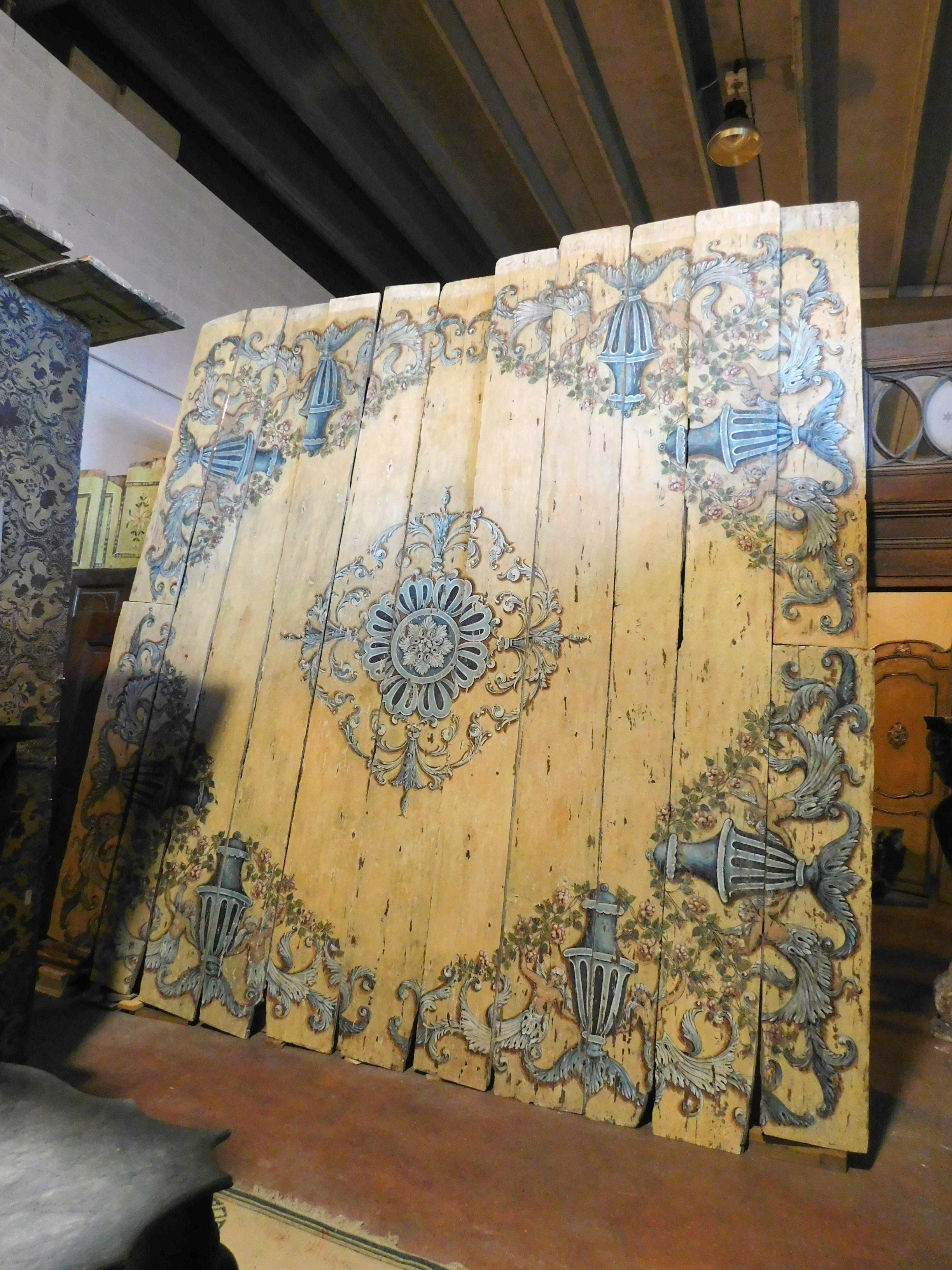Ancient hand painted wooden ceiling with Baroque motifs in dominant yellow and blue colors, composed of boards to be joined with a frame or applied to the ceiling / wall, original from the early 18th century,
from Central Italy. It was used on the