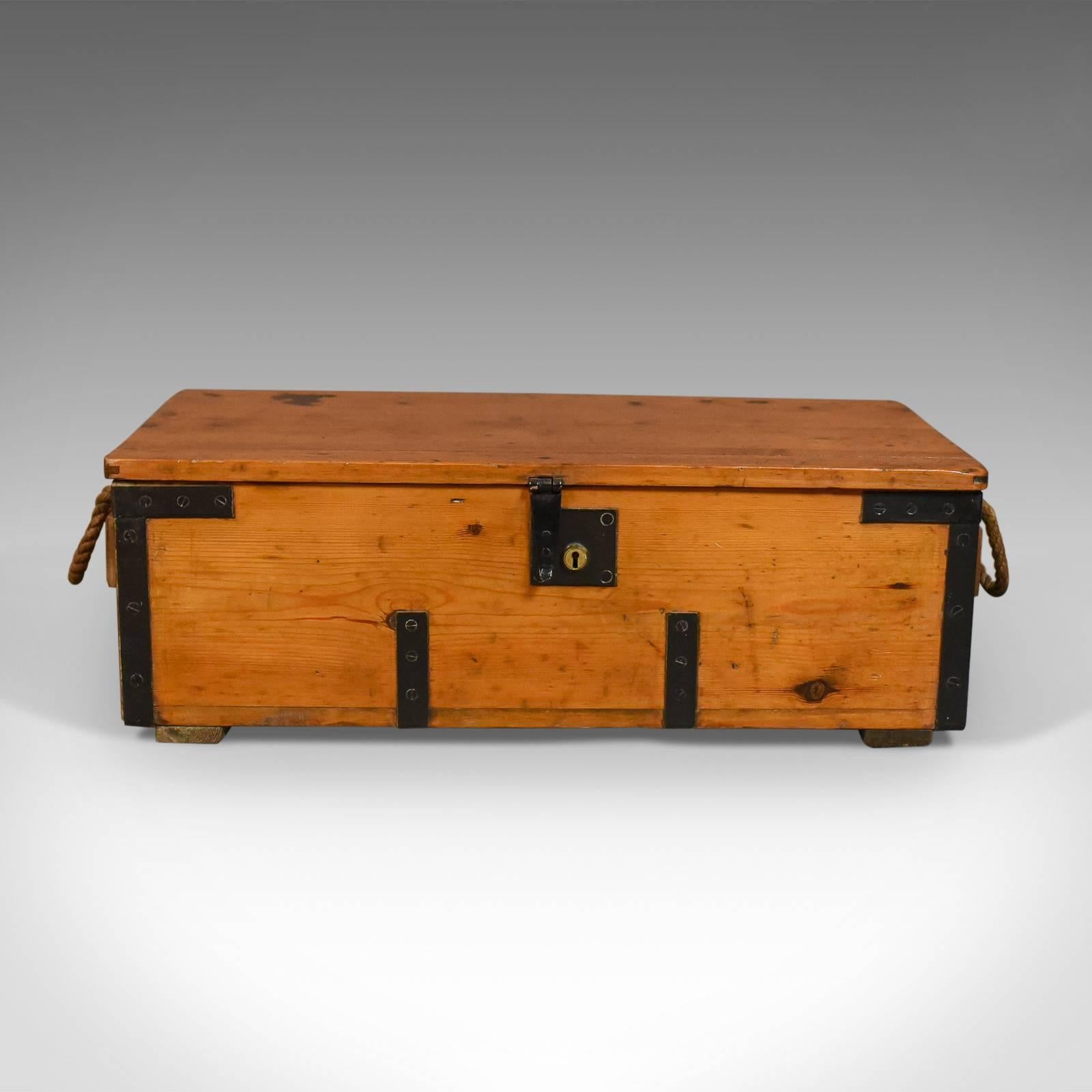 This is an antique boat-builders chest, an English, Victorian pitch pine trunk dating to, circa 1900.

Mellow tones to the pitch pine boards
Featuring teak end panels for added strength
Iron bound with a quality lock, plate and latch, key