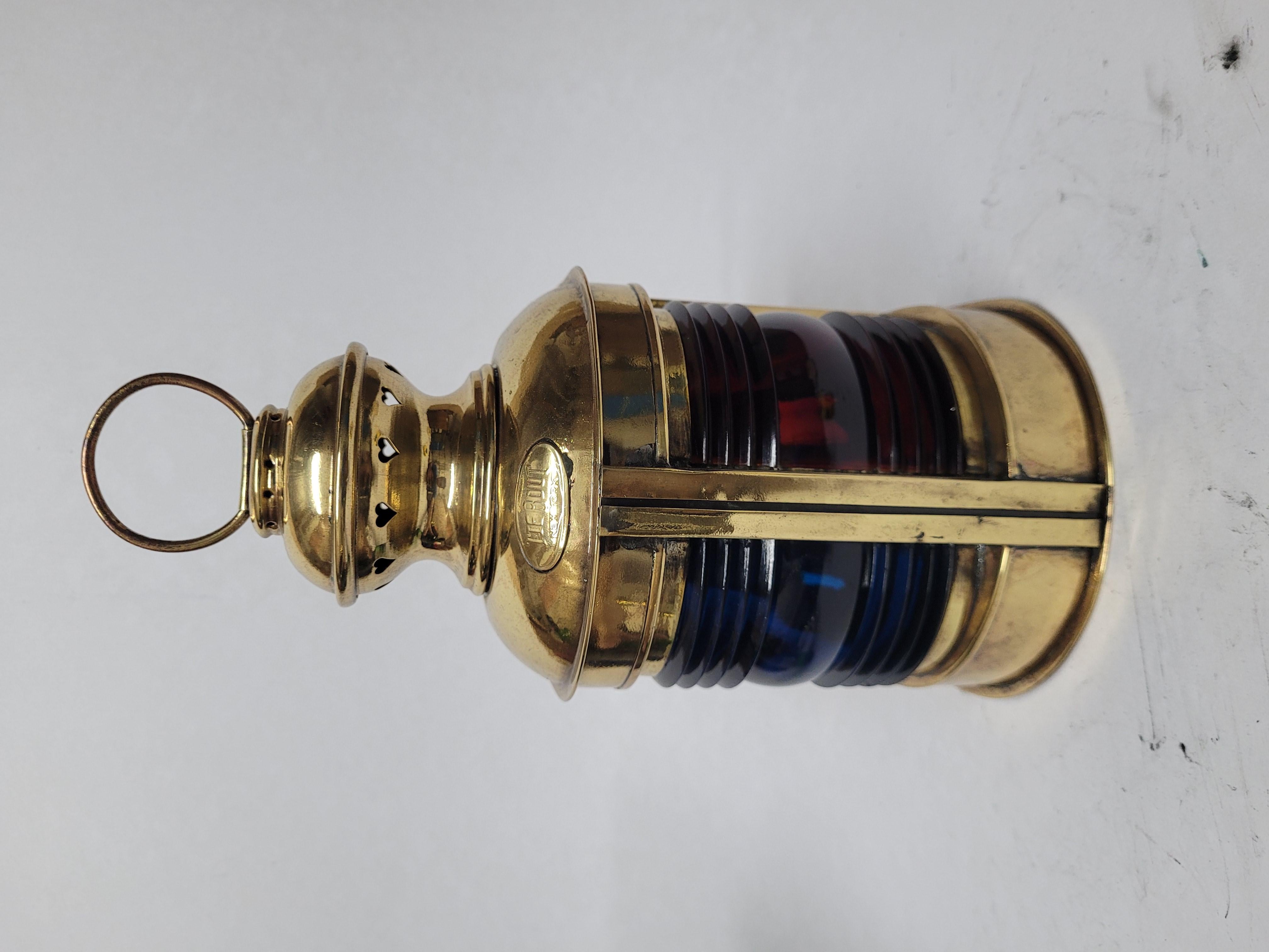 Bow lantern from a boat with red and blue fresnel glass lenses. Embossed brass makers tag from Tiebout of New York. With oil burner. Vented top and carry handle American Circa 1933

Weight: 1.71 lbs.
Overall Dimensions: 10 1/2