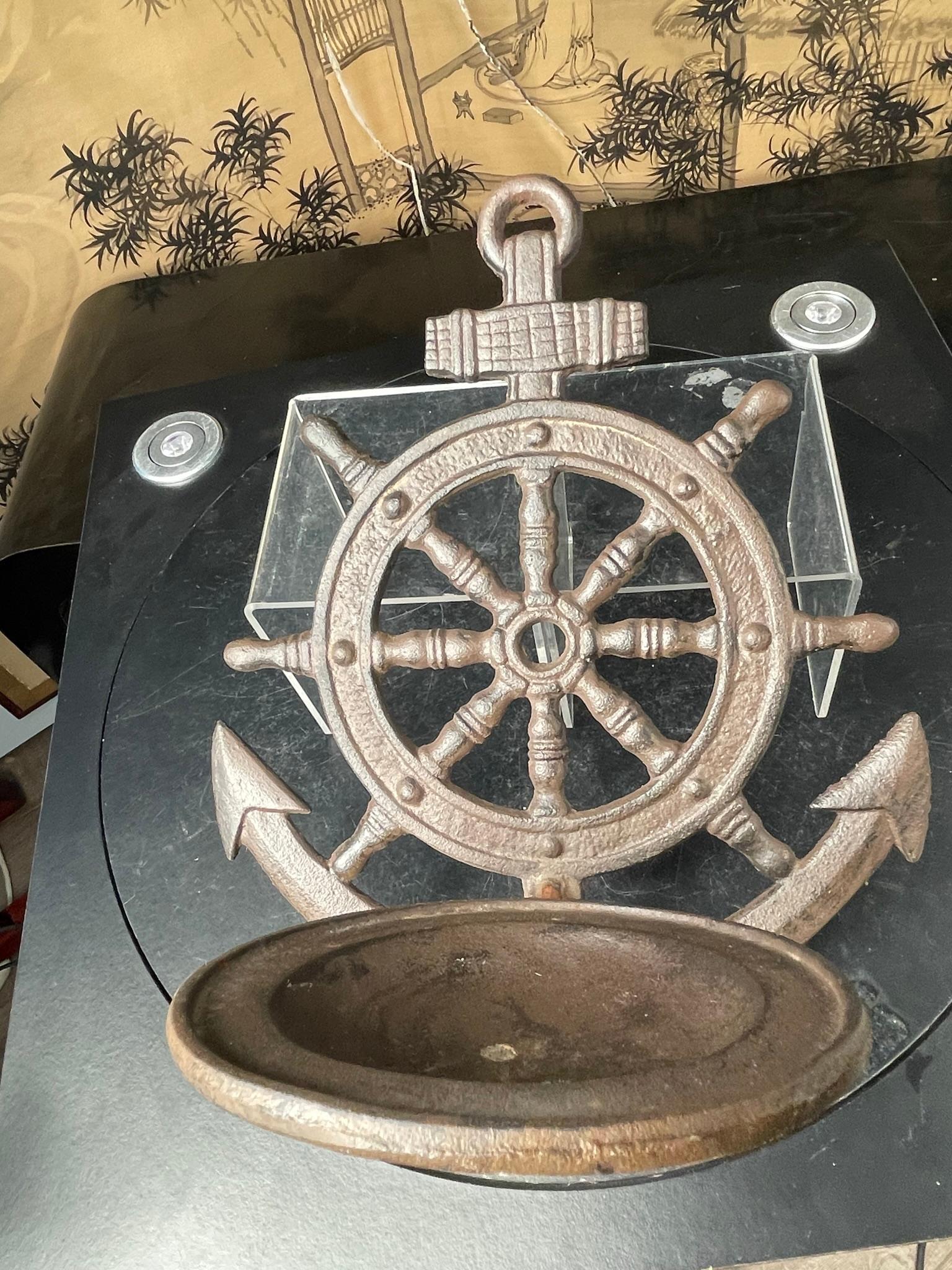 Nautical Lovers Delight- first we've seen

Unique Antique Boating Helm Wheel And Anchor Wall Shelf -a veresatile decorative accent perfect for displaying your LED, candles, or plant pot. 

Heavy quality hand cast hinged wall shelf unfolds and