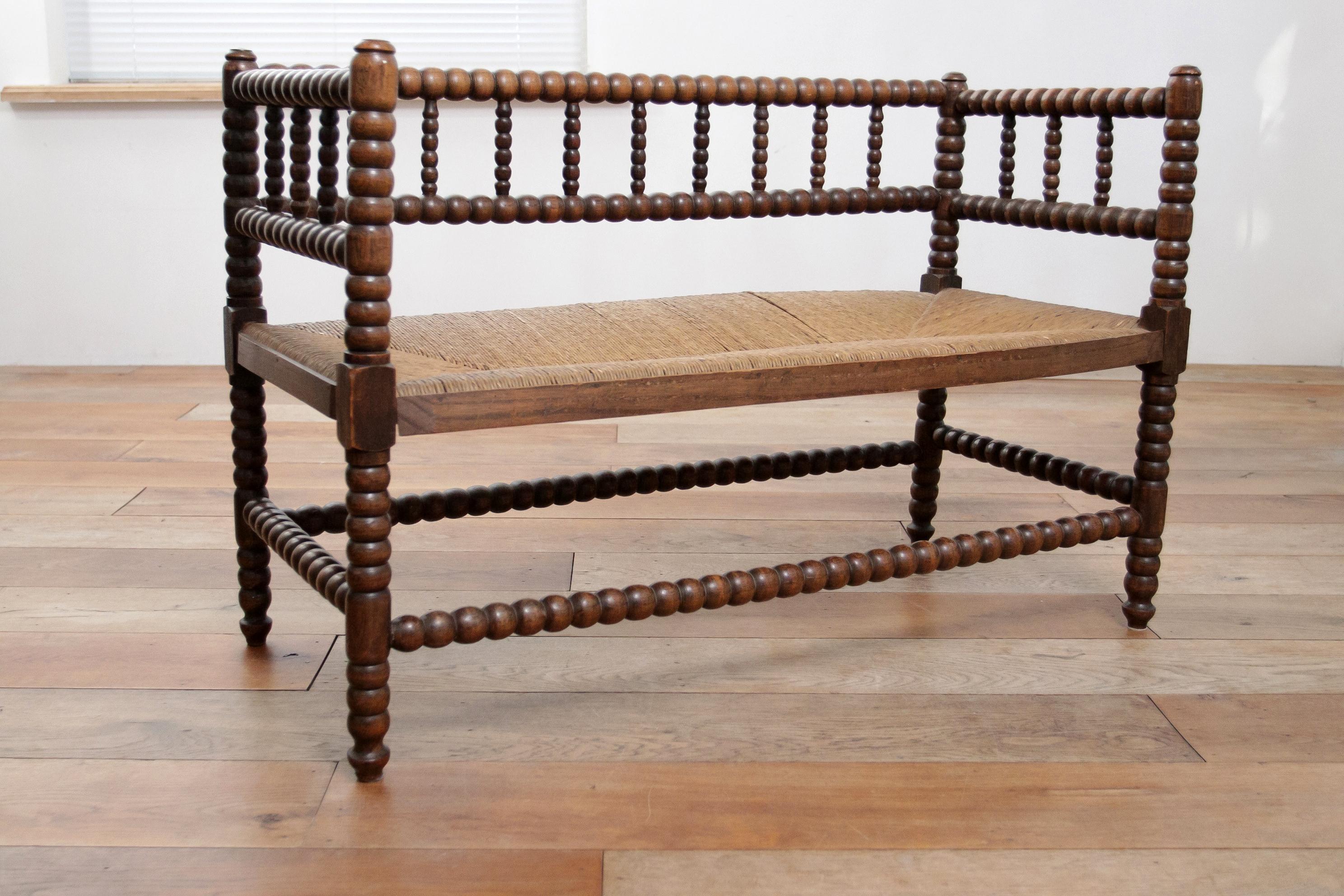 Antique Bobbin Bench A Blend of Craftsmanship and Heritage Rush Woven seat In Good Condition In Boven Leeuwen, NL