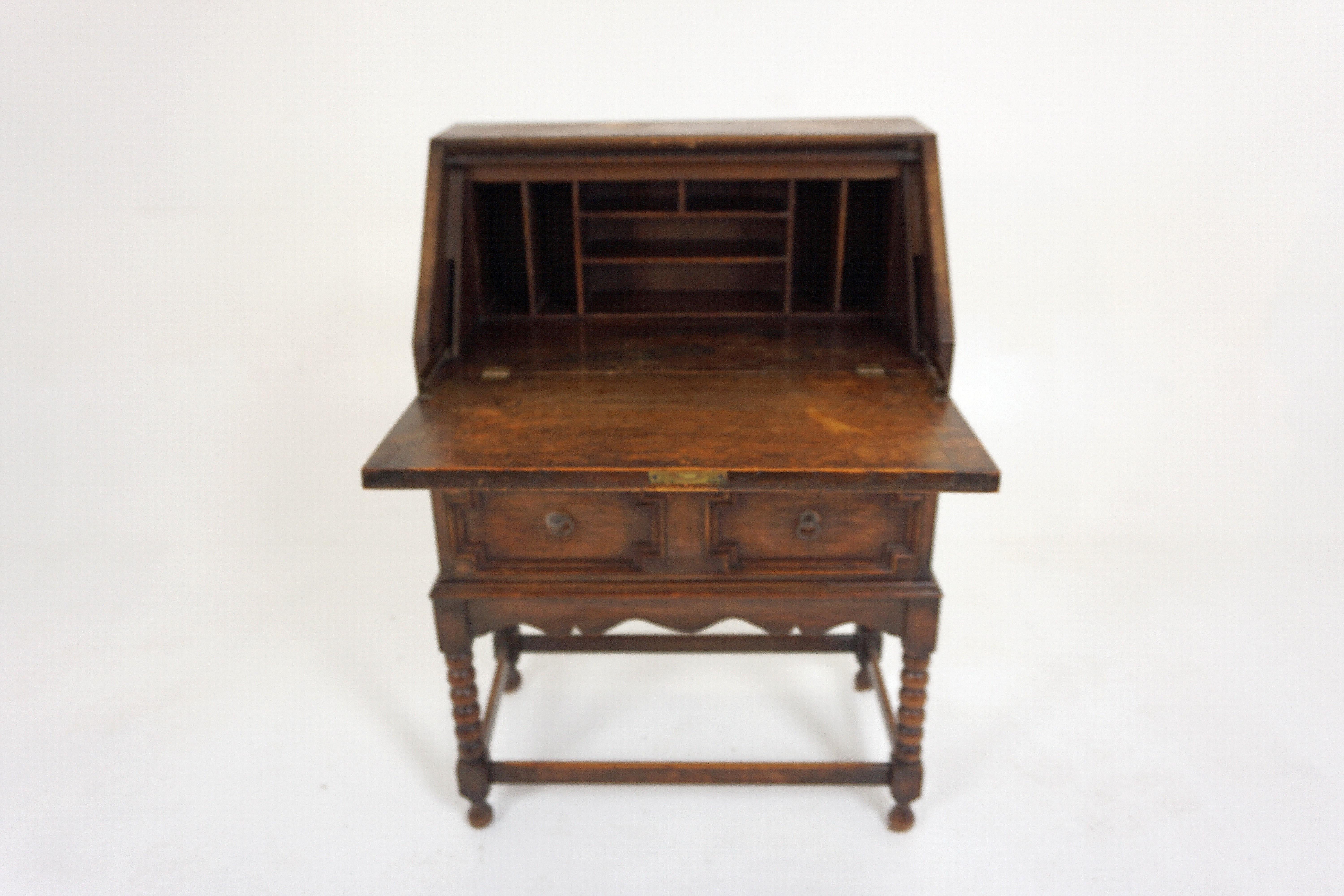 Antique Bobbin Leg Tiger oak drop front desk, Slant Front, Scotland 1920, H352

Scotland 1920
Solid Oak
Original Finish
Rectangular top
Having a fall front opening 
With cubby holes and writing surface above two graduating drawers
Shaped skirt
