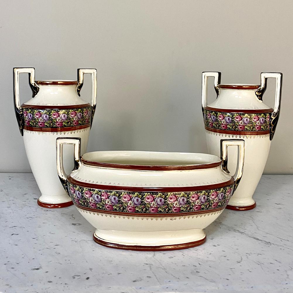 Antique Boch Jardiniere is a splendid example of craftsmanship from the famous maker out of Belgium, with a classical shape inspired by ancient Greek archeological treasures and a colorful display of roses and greenery with fine bordering. In fact,