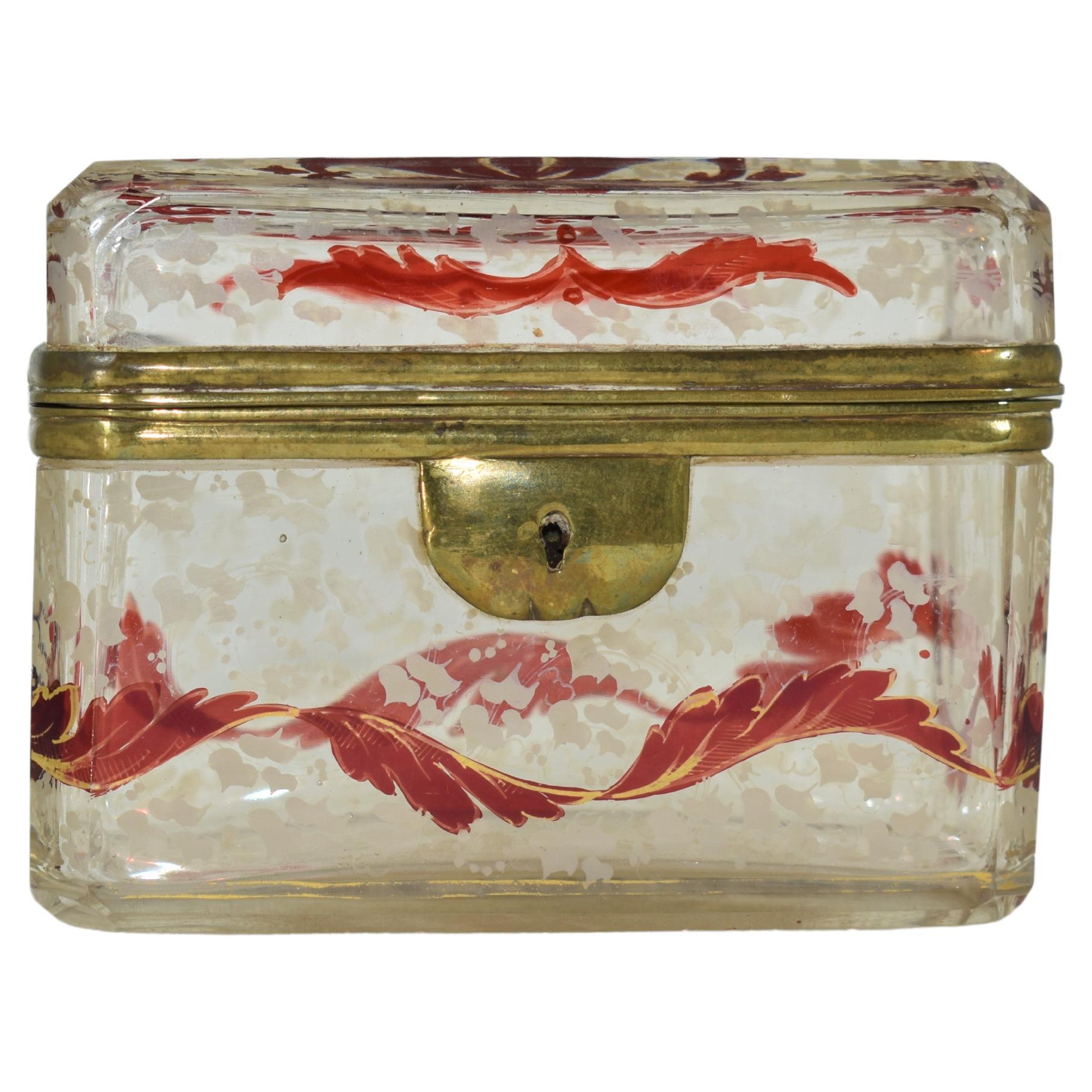 An extraordinary jewelery casket box made of clear glass with ruby decoration
Decorated all around with gilded ruby and white enamel and gilding highlights
Bohemia, 19th century.