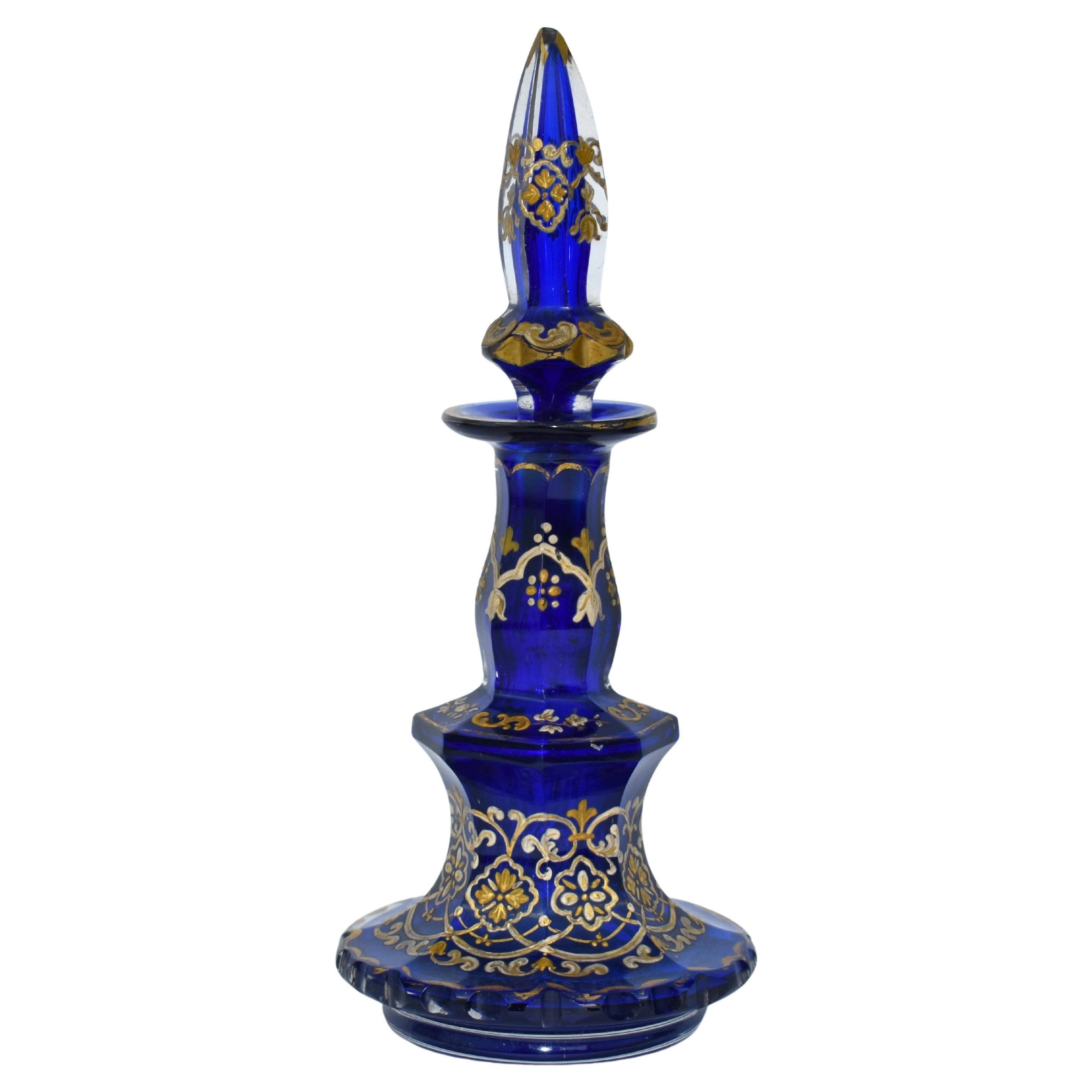 Brilliant Cobalt Blue Cut-Glass Decanter, Perfume Bottle from the Highest Quality Bohemian Glass Manufacture of the 19th Century

The body cut in multiple side panels and profusely Decorated with Gilded Enamel

Further enamelling on the neck and