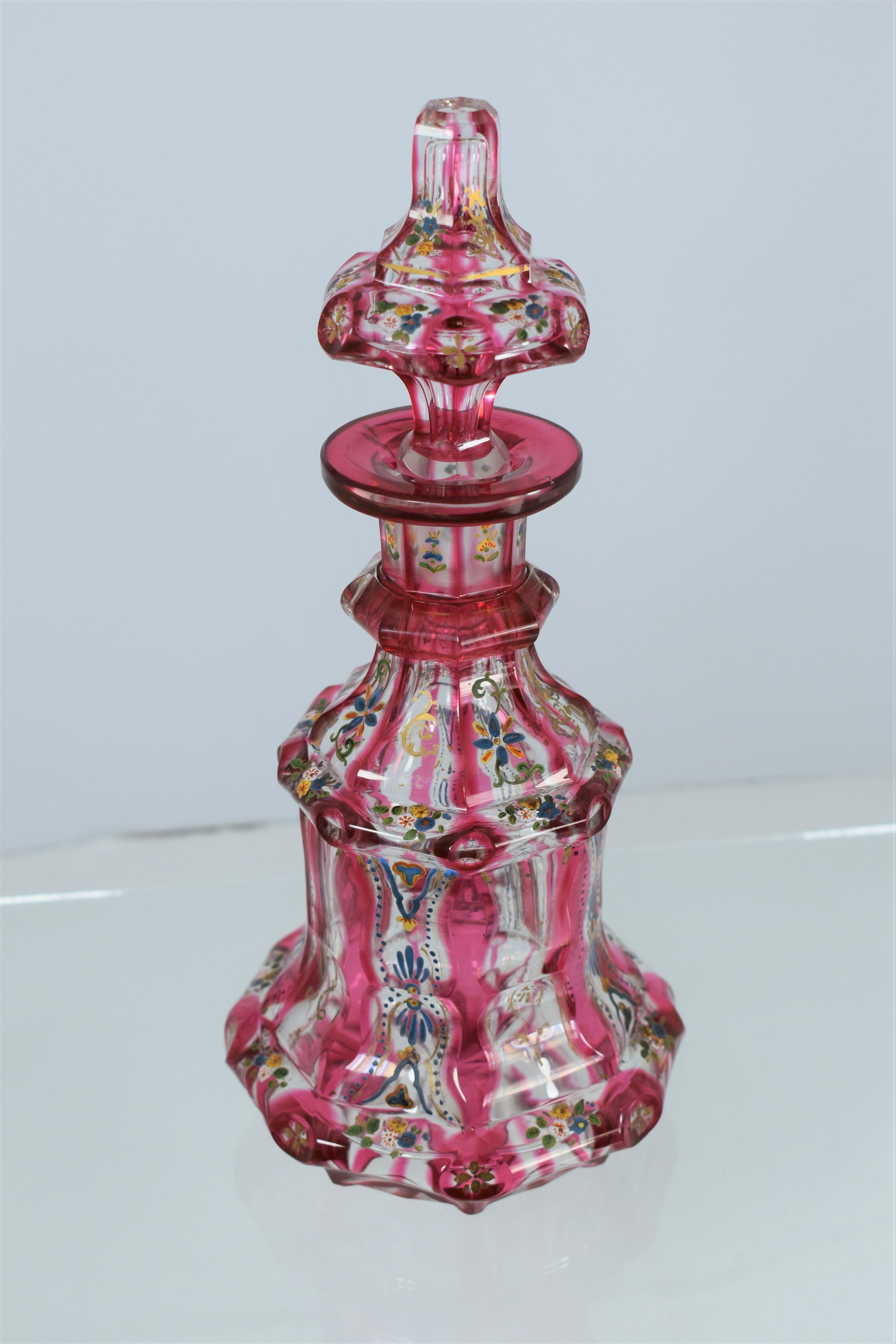 An exceptional perfume bottle (flacon) and stopper made of bohemian cranberry cased cut clear-galss, impressively enamelled and cut all around, a museum quality item in stunning condition, Bohemia, 19th century.