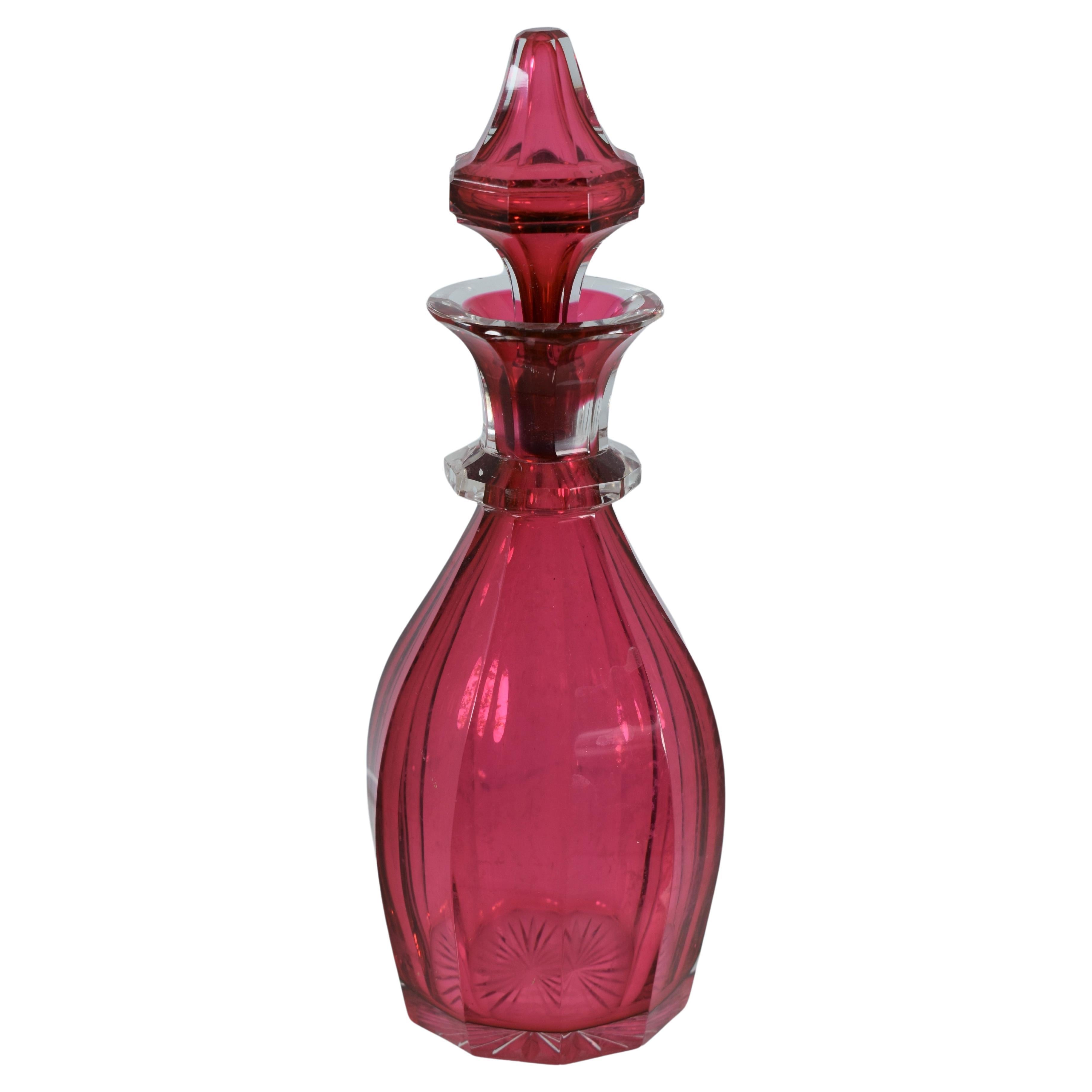 Cranberry glass perfume bottle.
Bohemia, 19th Century.
Measures: 21 cm high.
 