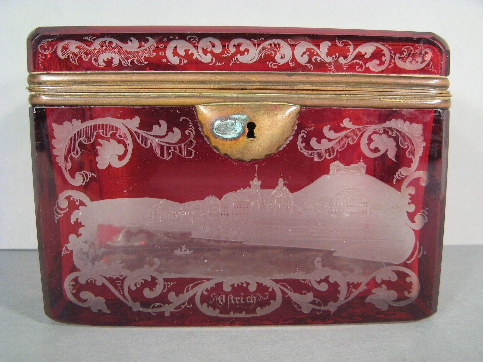 This exquisite antique jewelry box, crafted from Bohemian crystal, dates back to the Napoleon III era in the second half of the 19th century. The rectangular box, with its beveled edges, features a rare and intriguing engraved design depicting