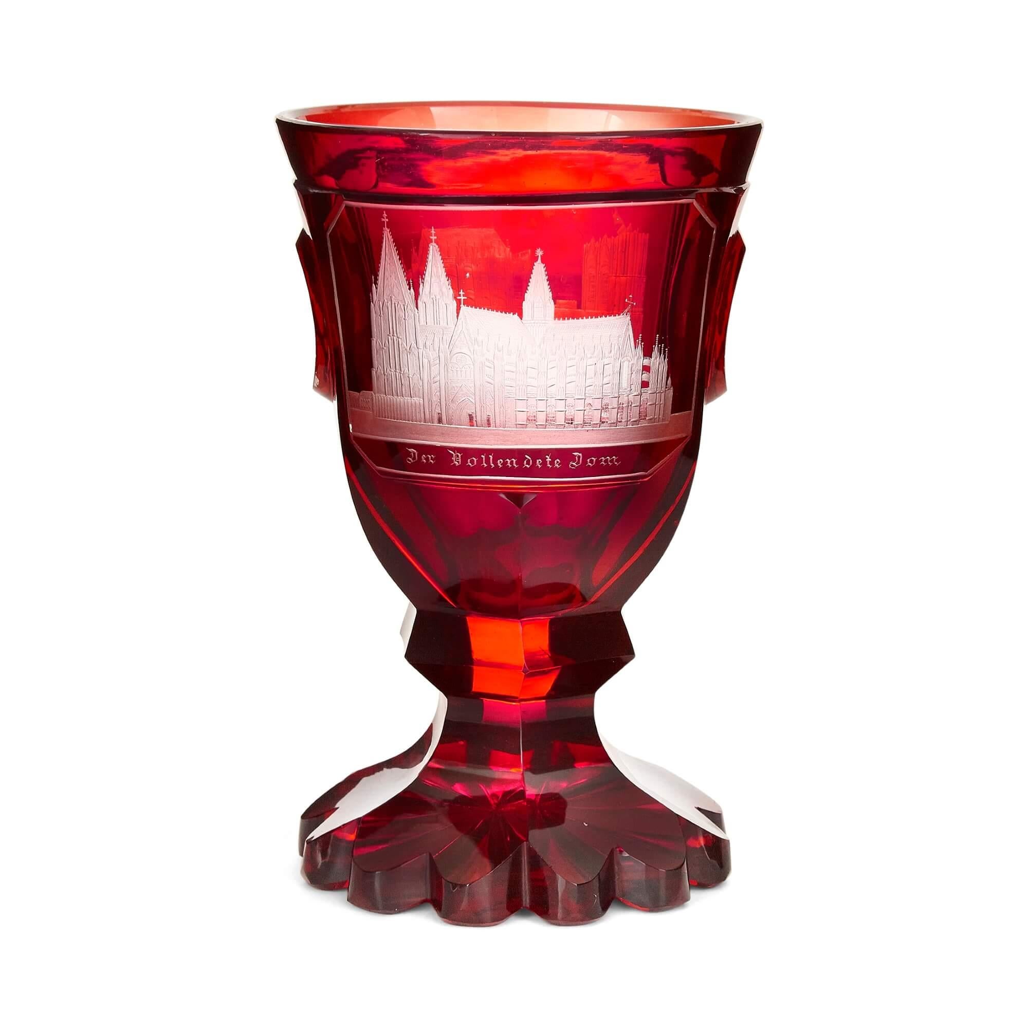 Antique Bohemian cut glass ruby red goblet
Bohemian, 19th Century
Measures: Height 16.5cm, diameter 10cm

The goblet is crafted from ruby Bohemian glass in a traditional style, featuring a shaped circular foot below a waisted facet cut stem,