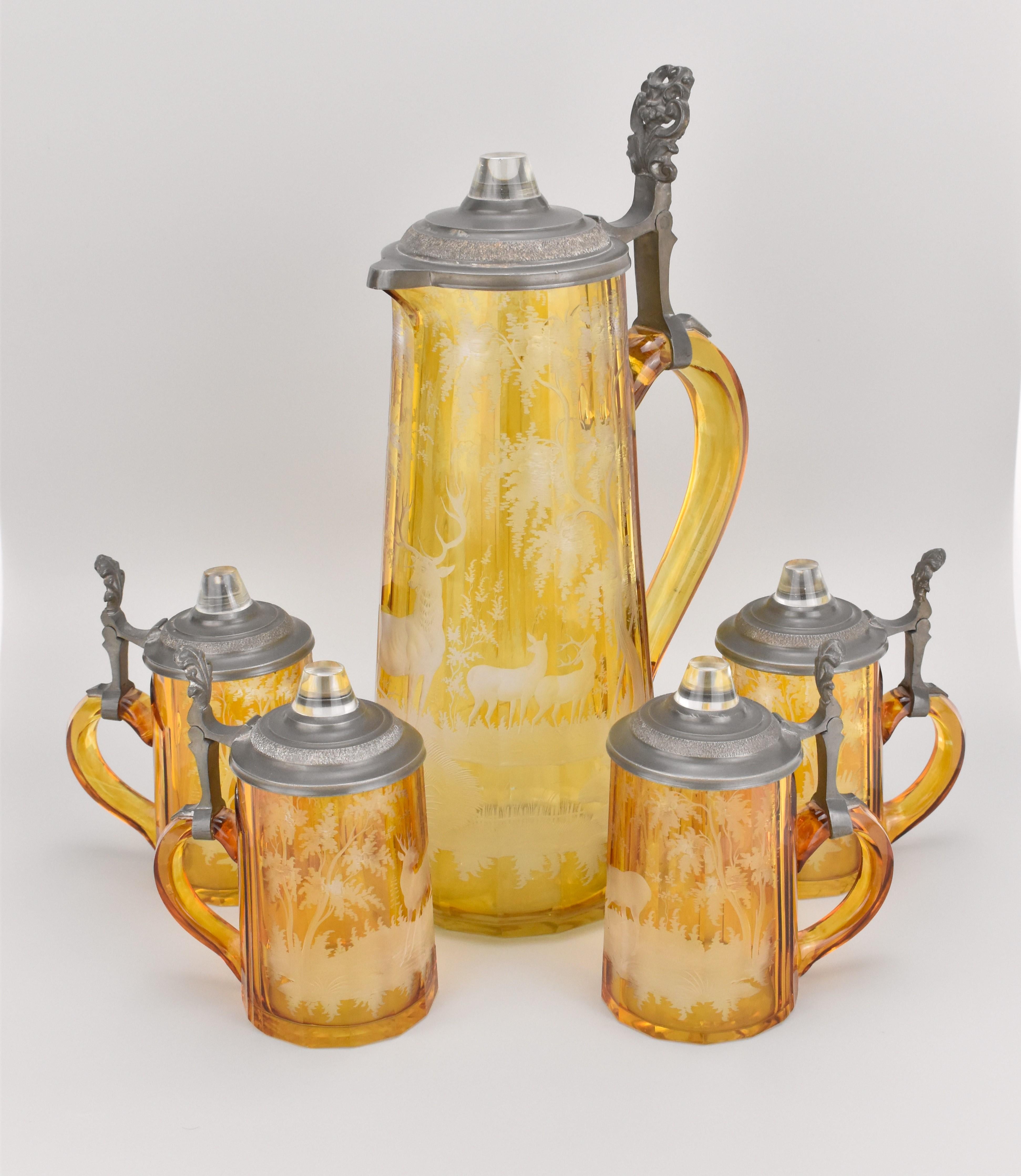 Set of Jug and Four Matching Glasses with Engraved Nature Scenes – Bohemian Glass, Circa 1850

This stunning set consists of a jug and four matching glasses, all intricately engraved with detailed nature scenes. The jug’s polygonal body features a